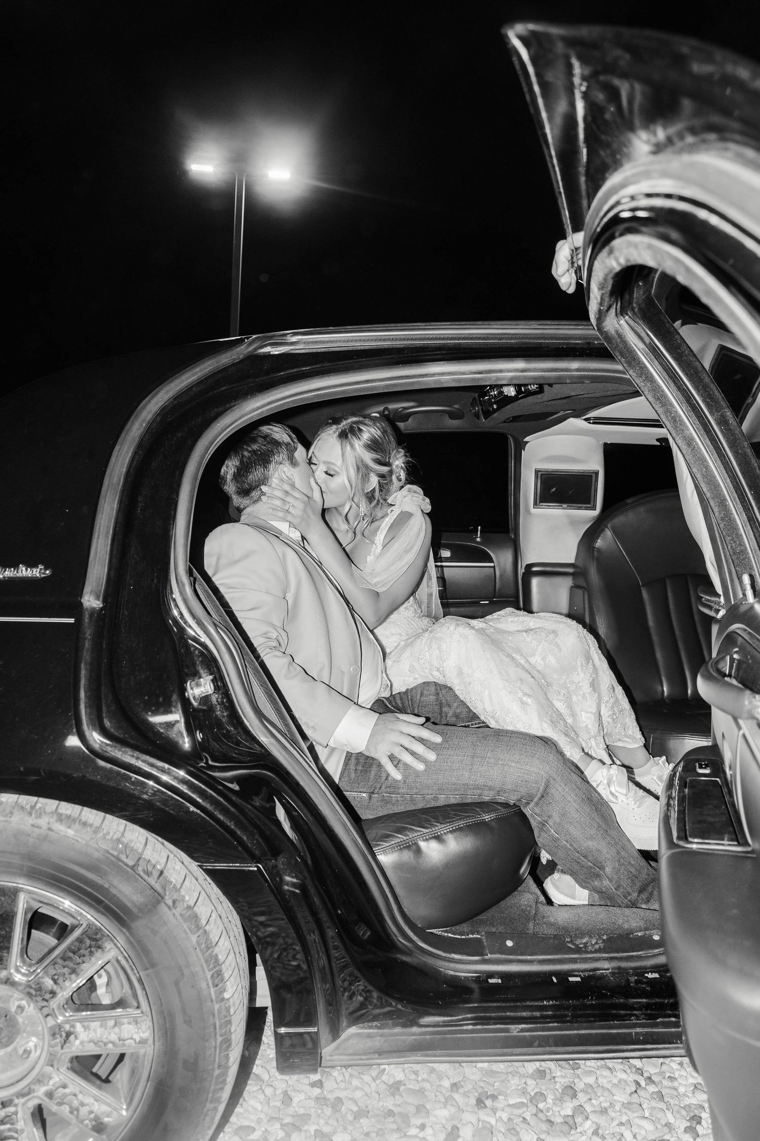 Couple kissing in limo after China Spring TX Wedding