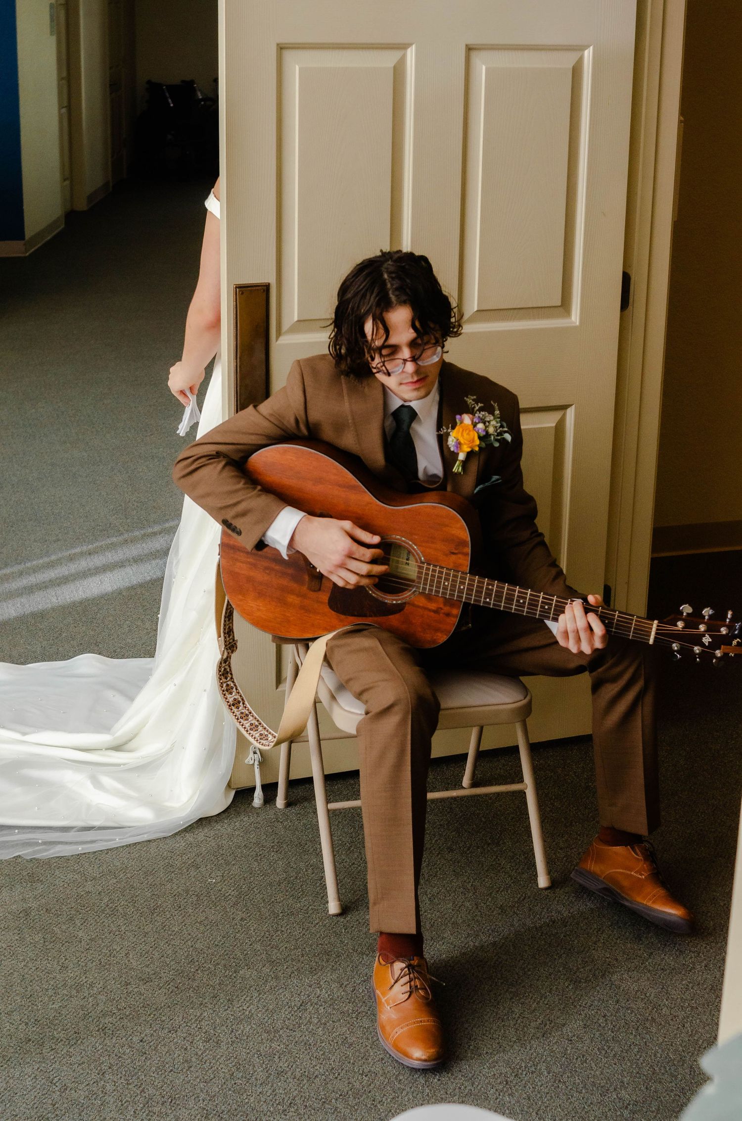groom plays a song for his bride