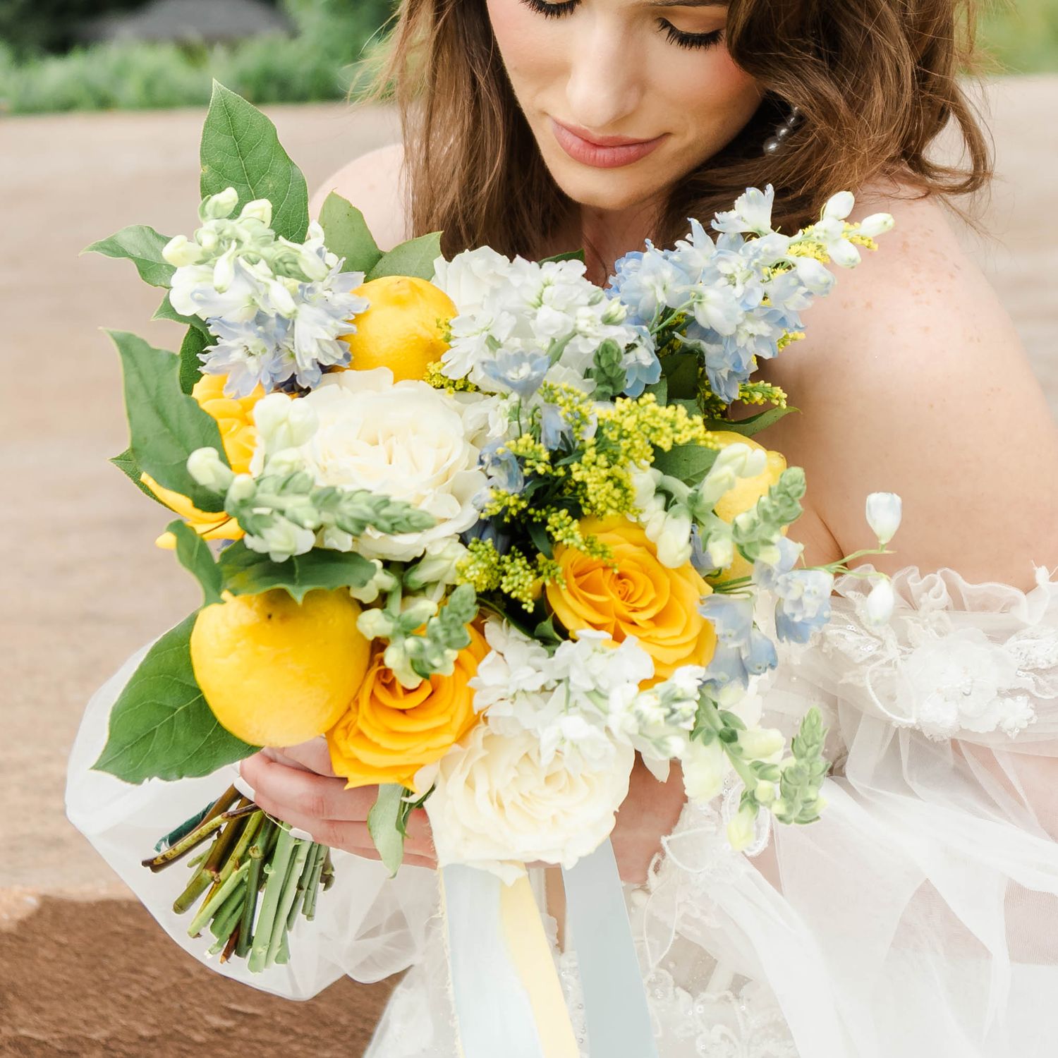 yellow bouquet featuring yellow roses and lemons