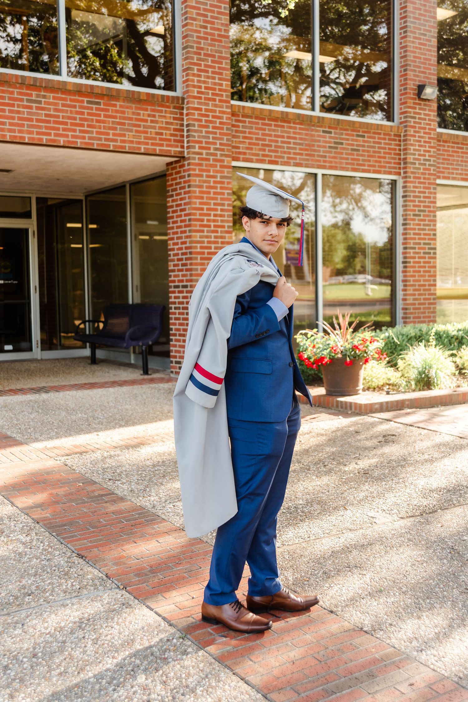 a senior in his cap and gown