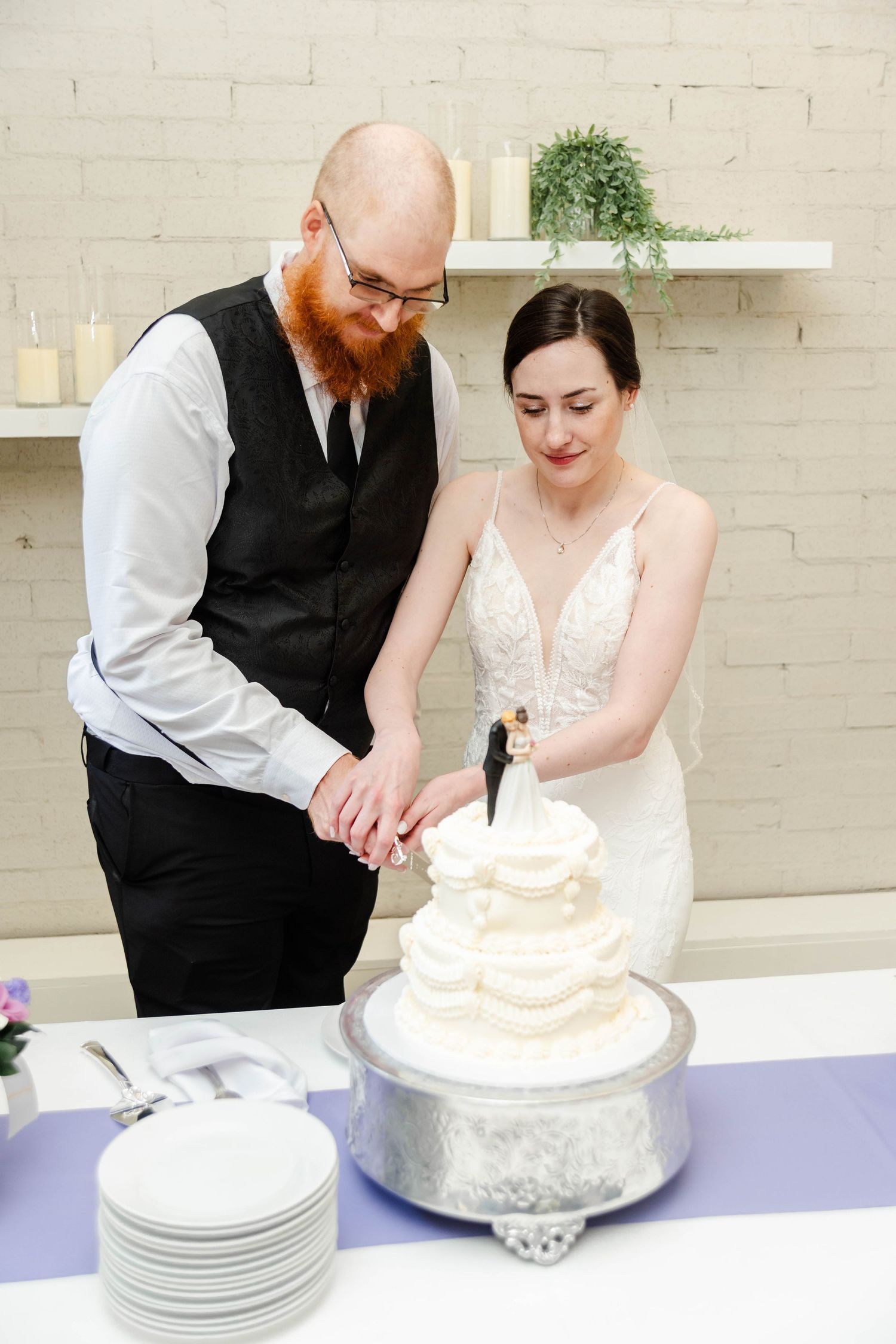 a couple cutting a cake