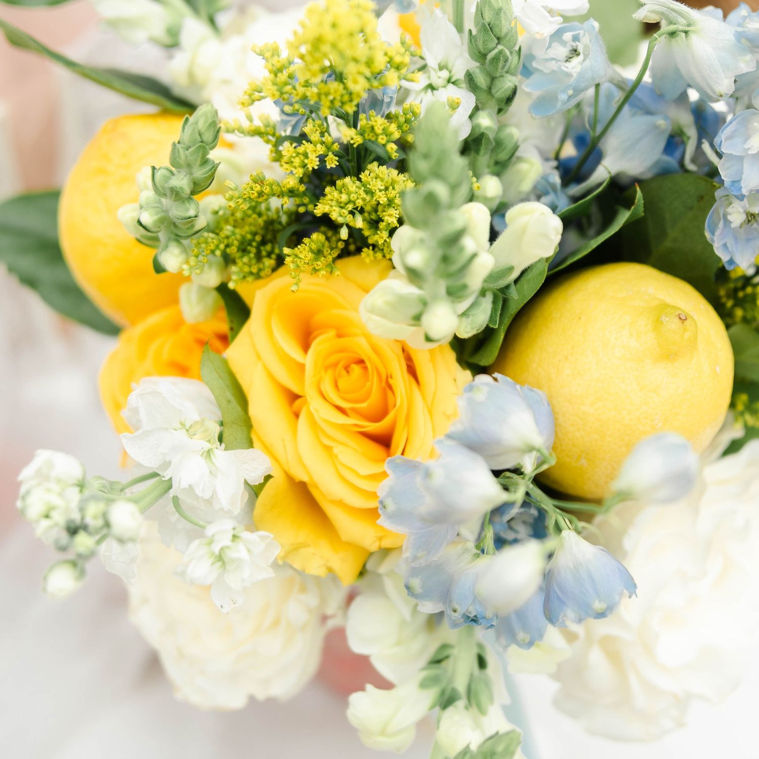 yellow bouquet featuring yellow roses and lemons