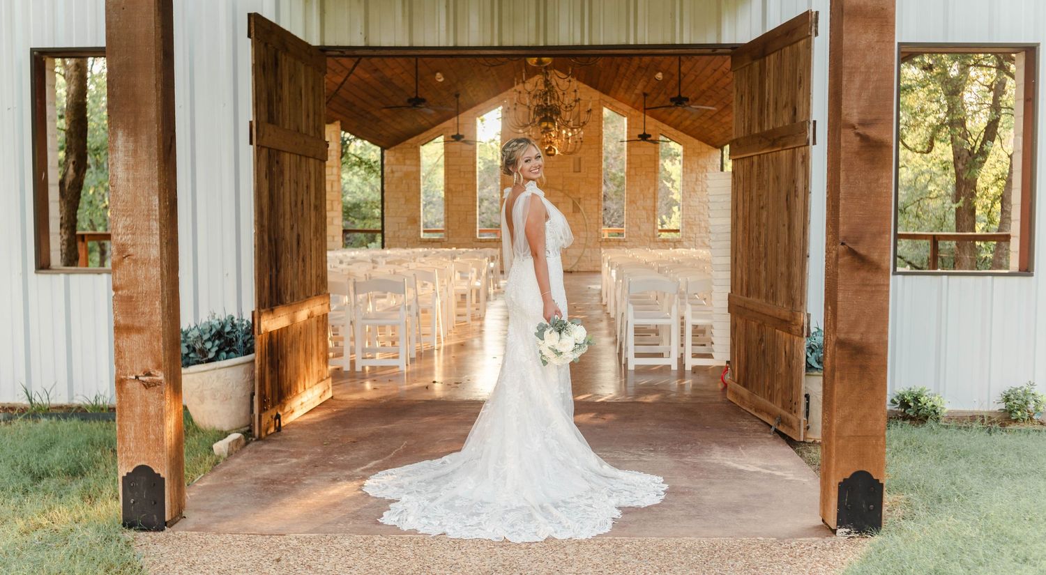 A bride standing at the chapel doors at Fossil Creek Retreat in China Spring, Texas