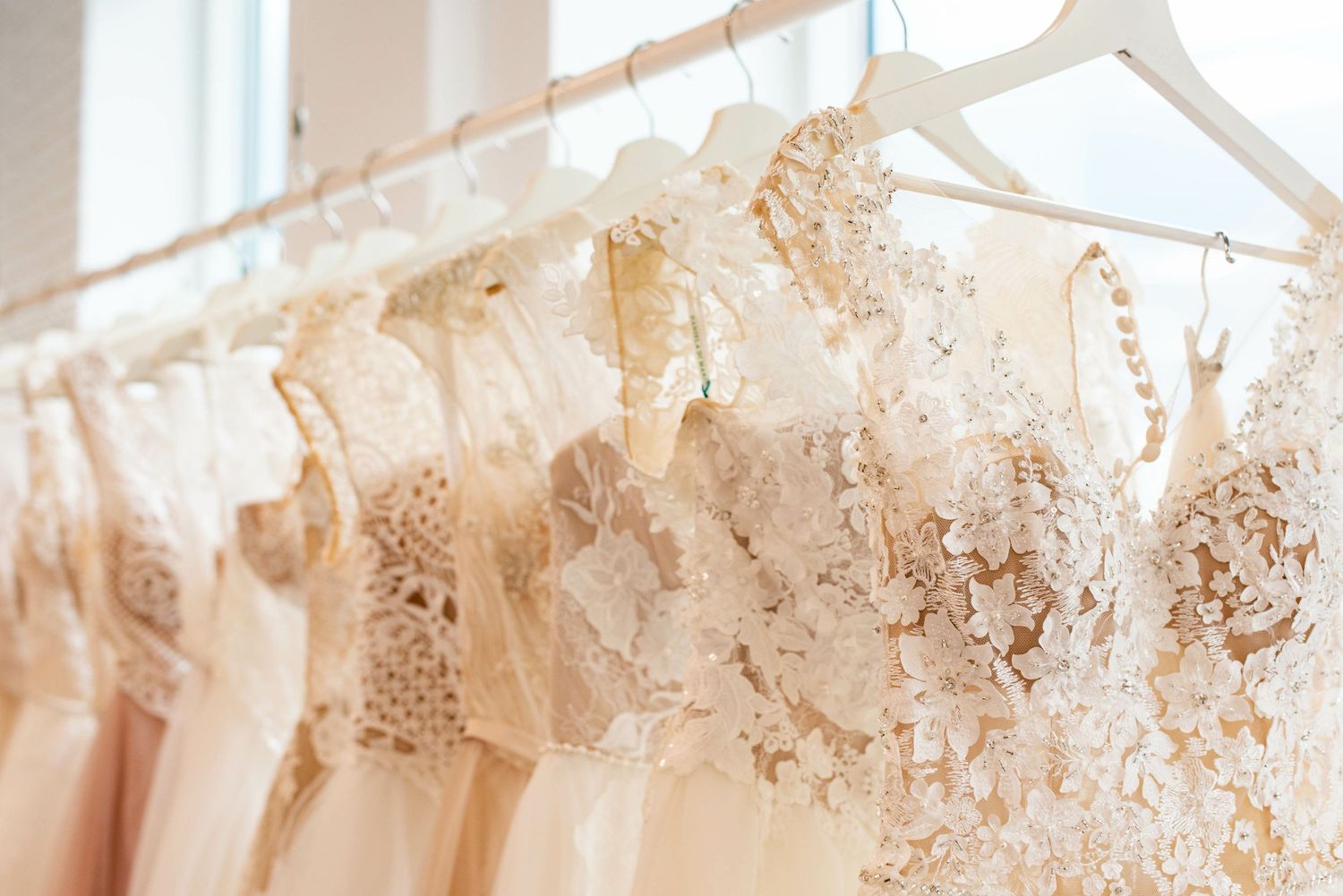 A Rack of Wedding Dresses Hanging Up