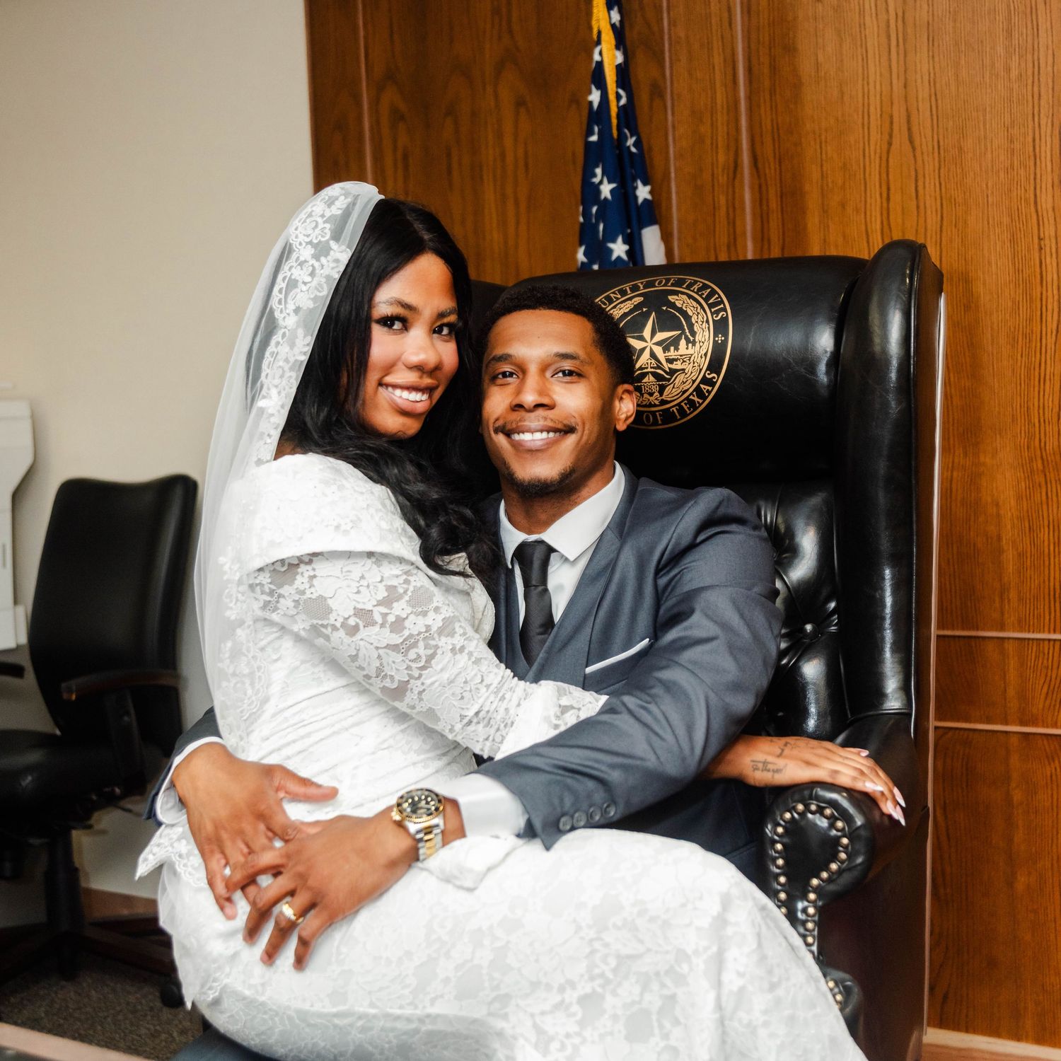 A couple holds each other in a courthouse