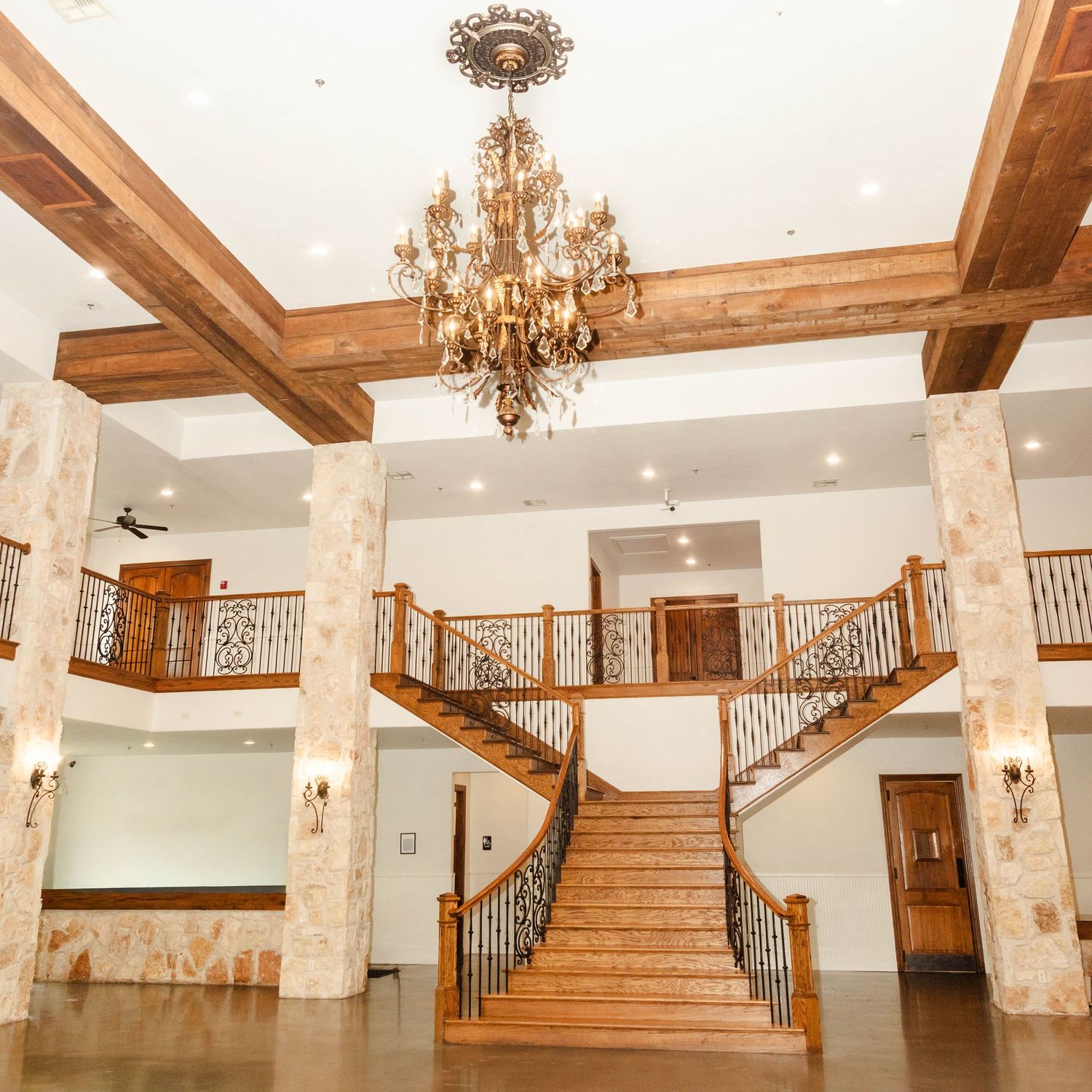 grand staircase with chandelier
