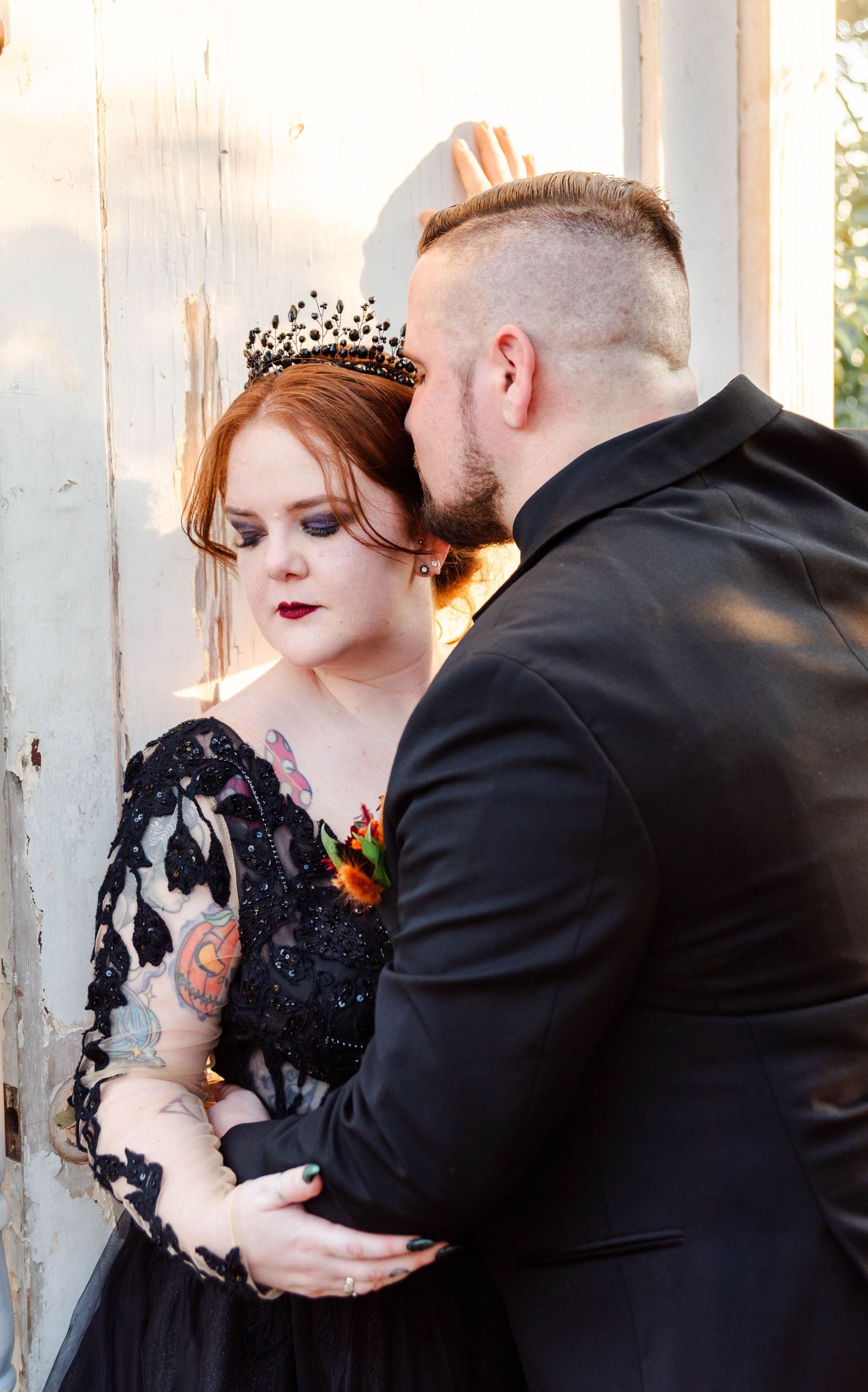groom kissing brides hair