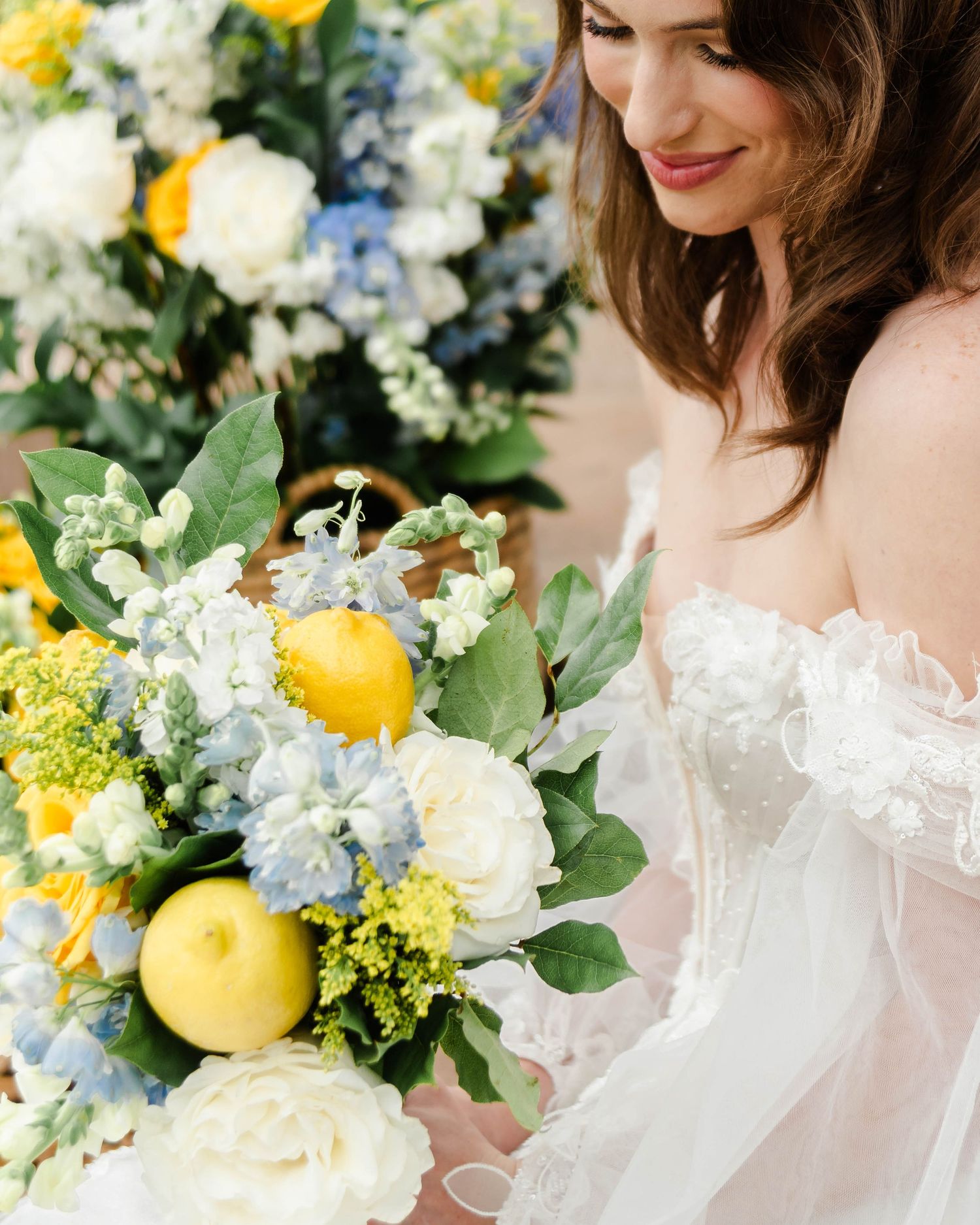 A woman smiles at her lemon bouquet