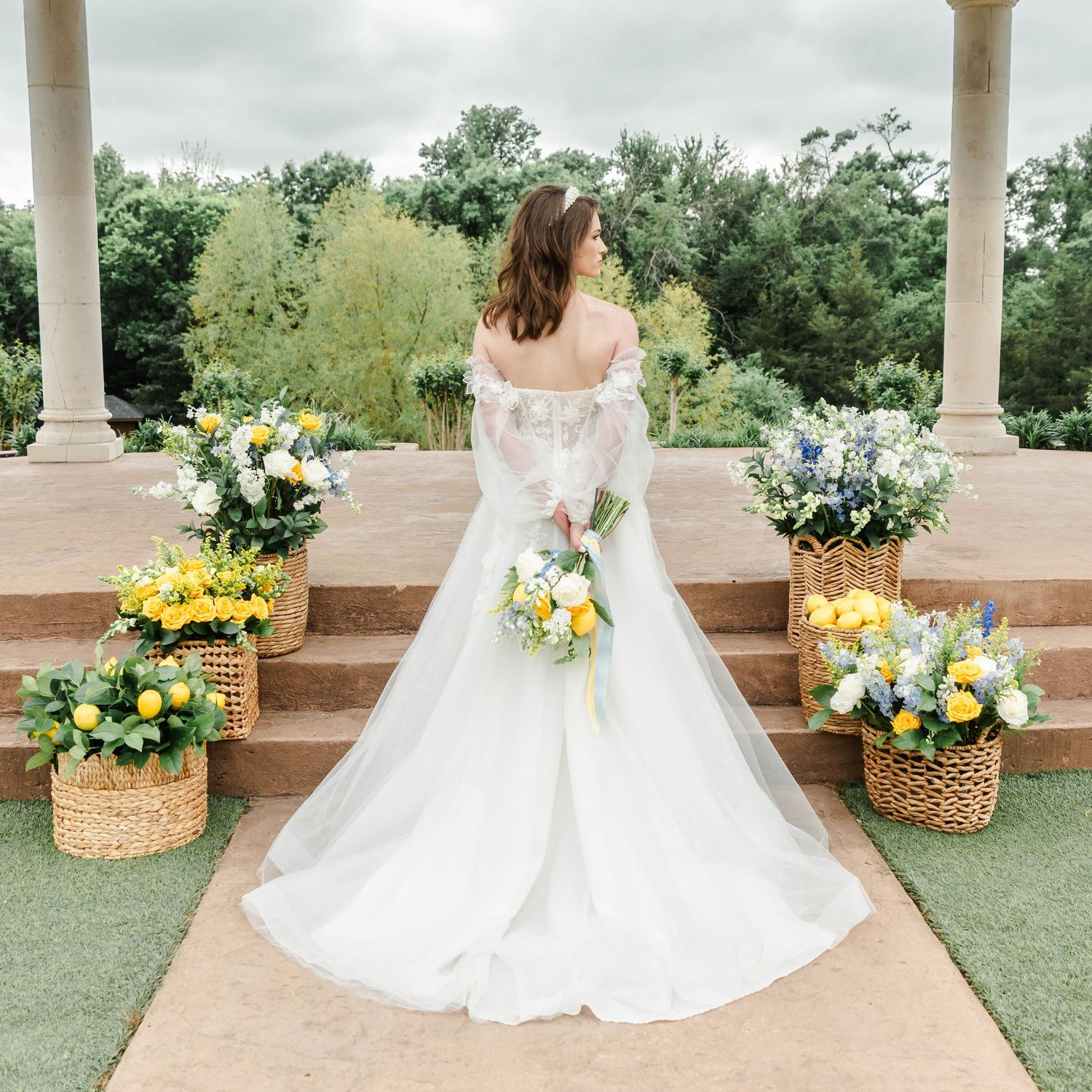 ceremony set up featuring blue and yellow flowers and lemons