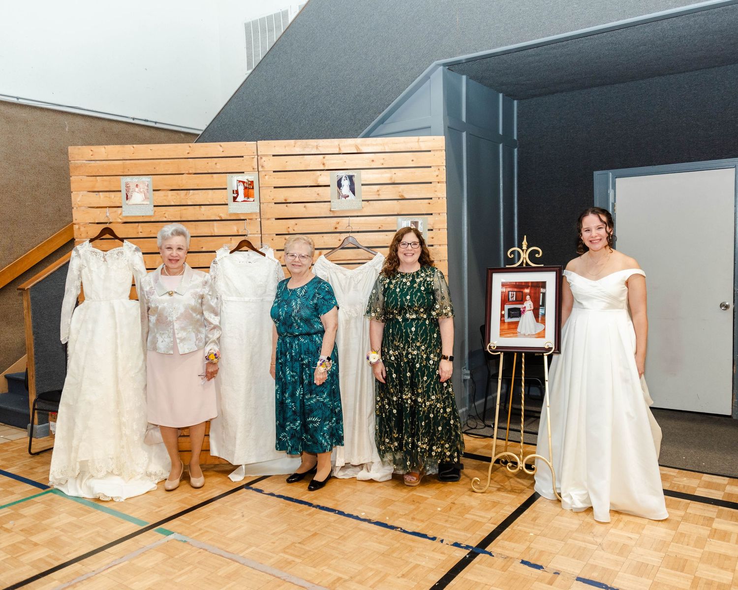 a setup of the grandmothers and mothers wedding dresses for a legacy photo
