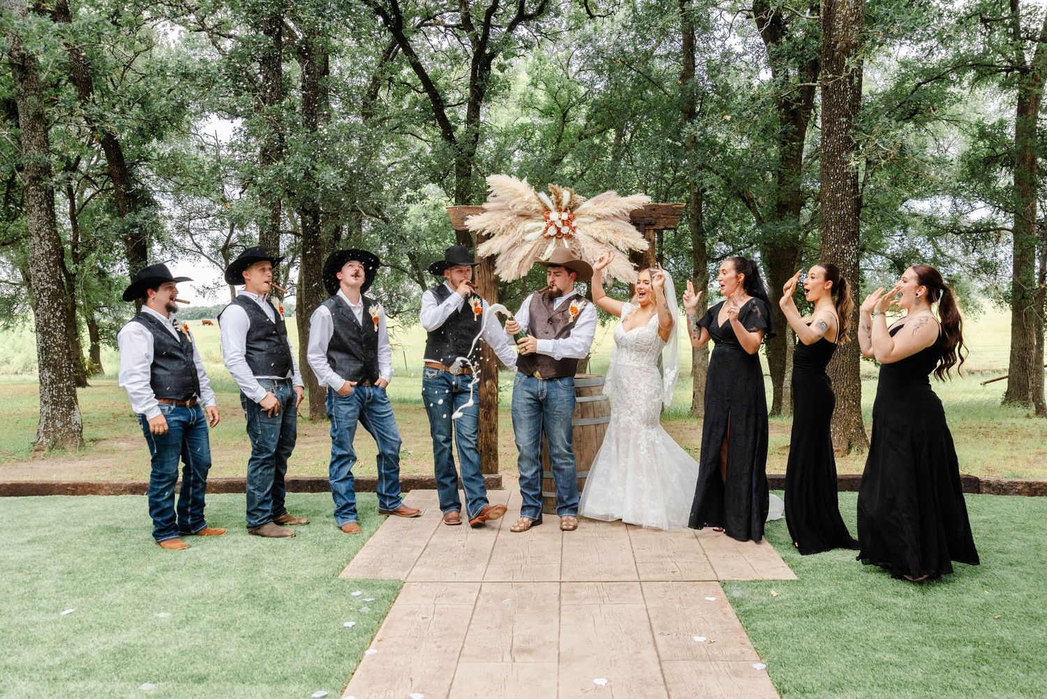 a couple celebrates with their wedding party