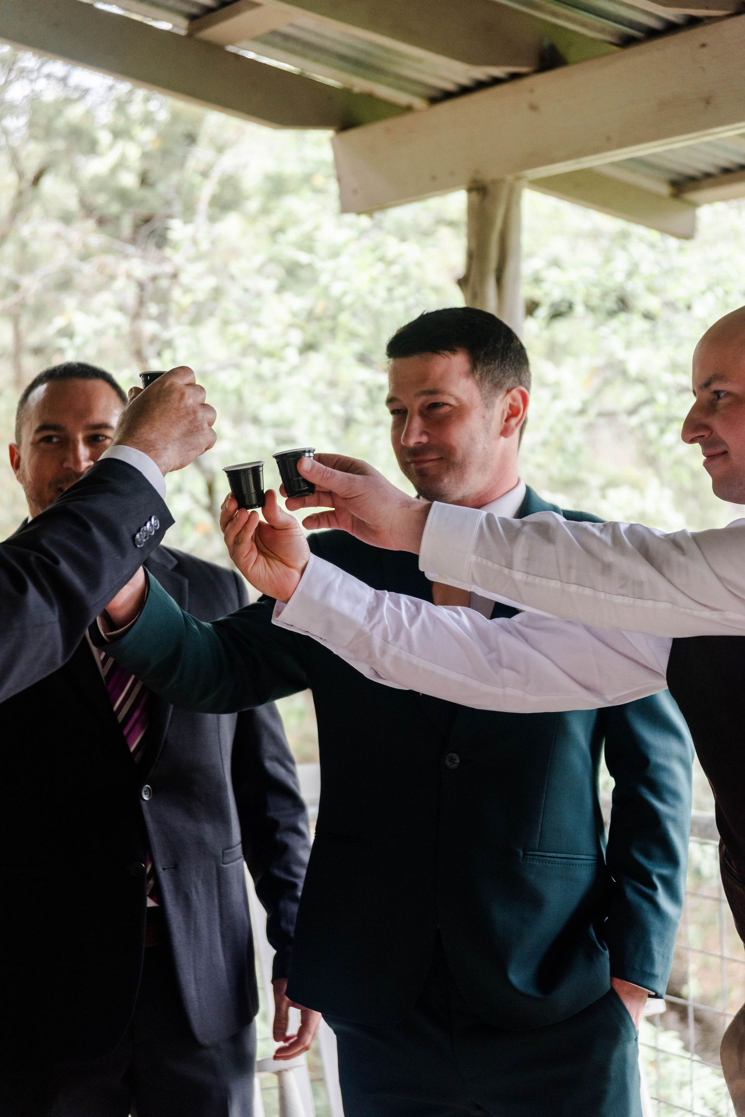 men are in a group holding drinks