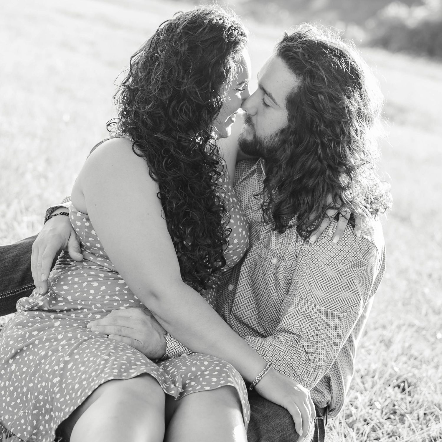 a couple embracing while sitting