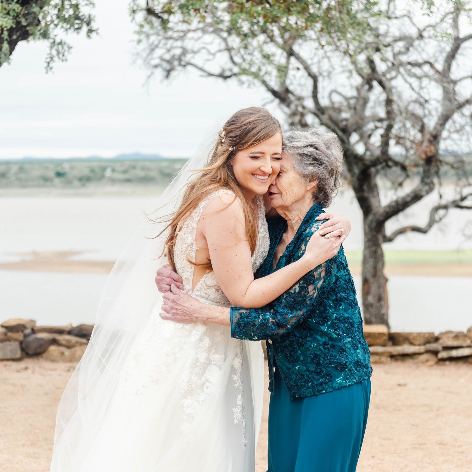 a bride and her grandmother hugging