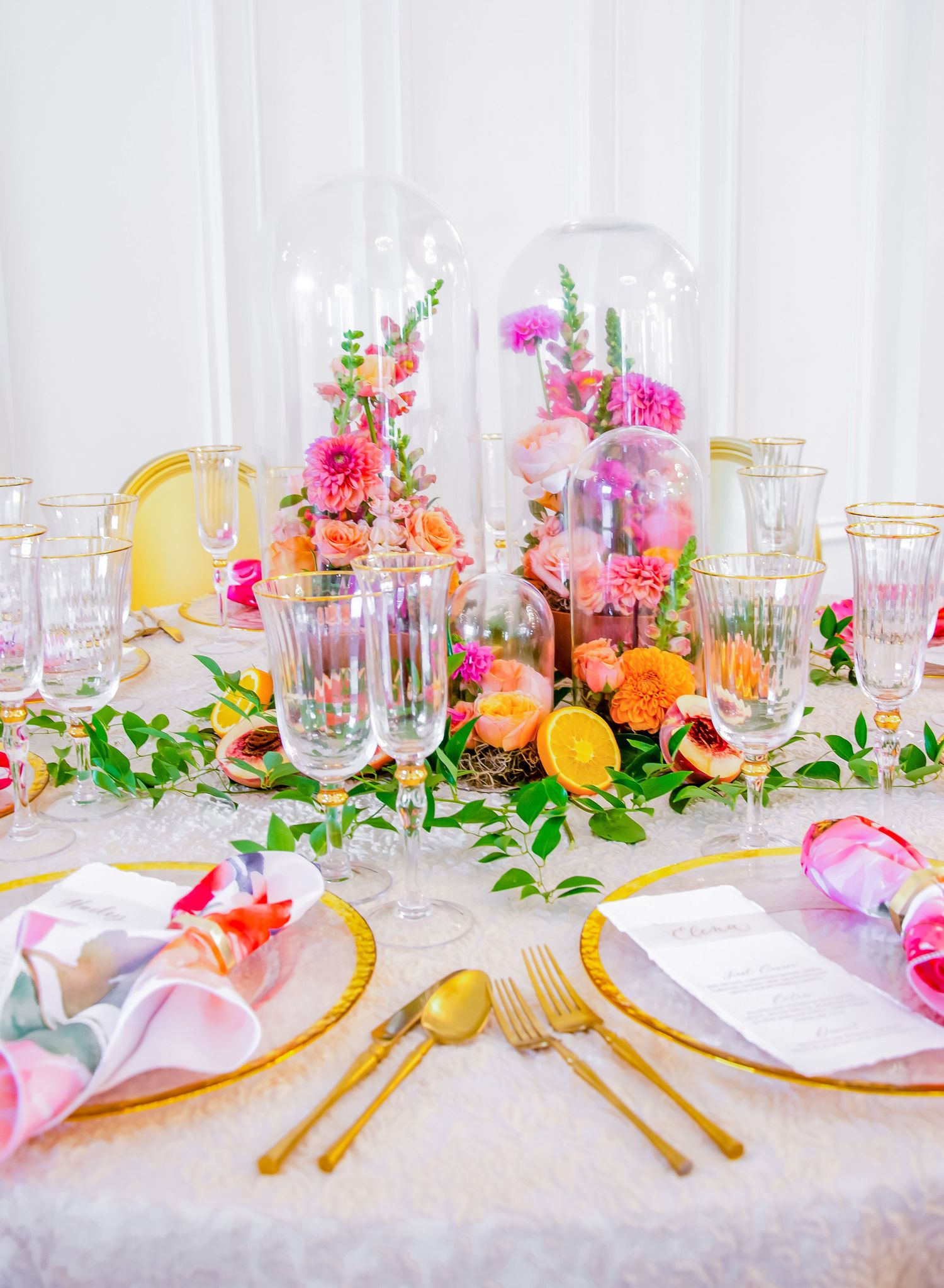 A table setting for a brightly colored wedding