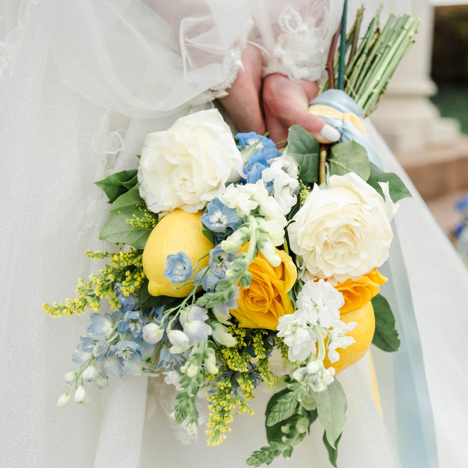 yellow bouquet featuring yellow roses and lemons