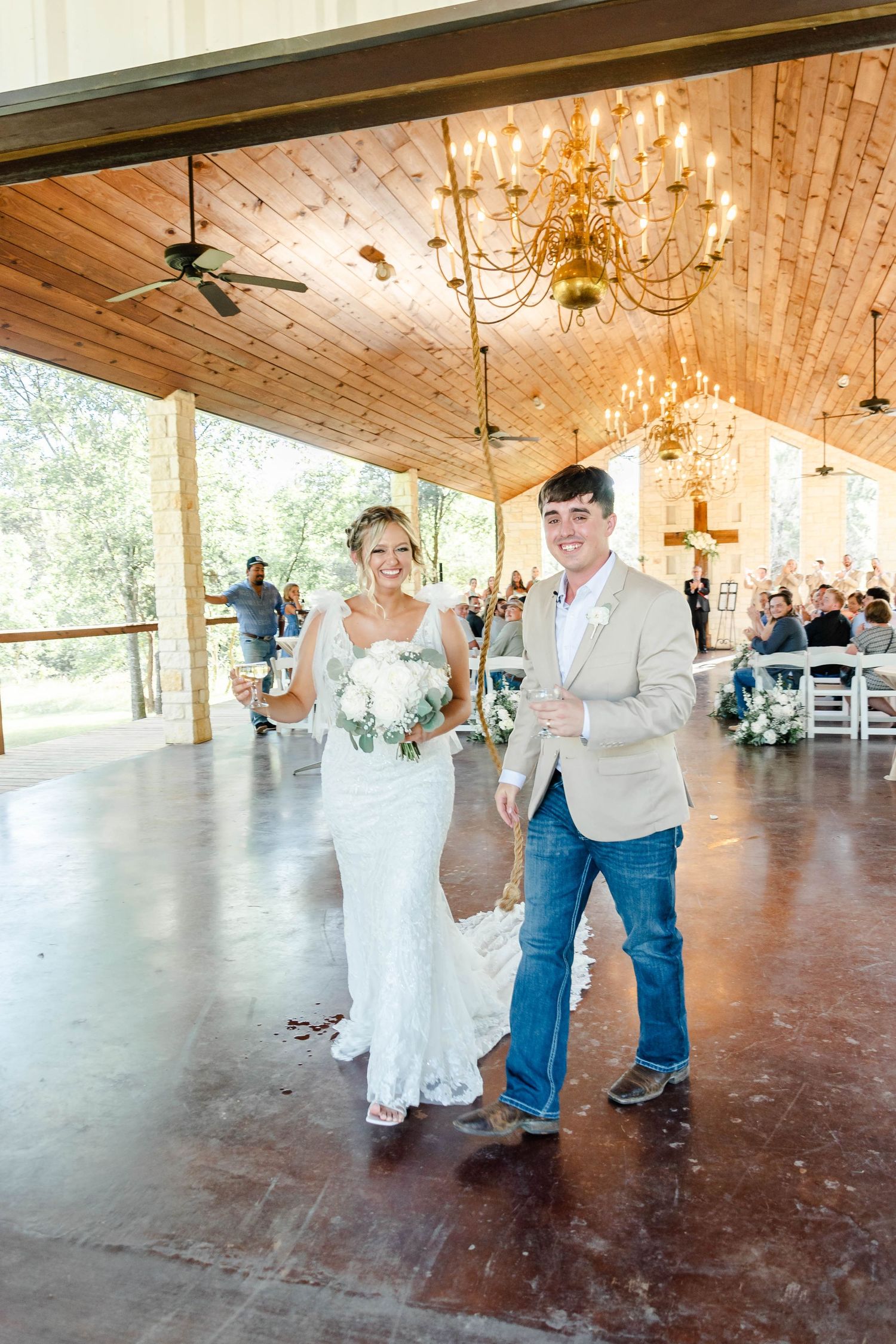 Couple ringing bell at chapel in Waco Texas wedding
