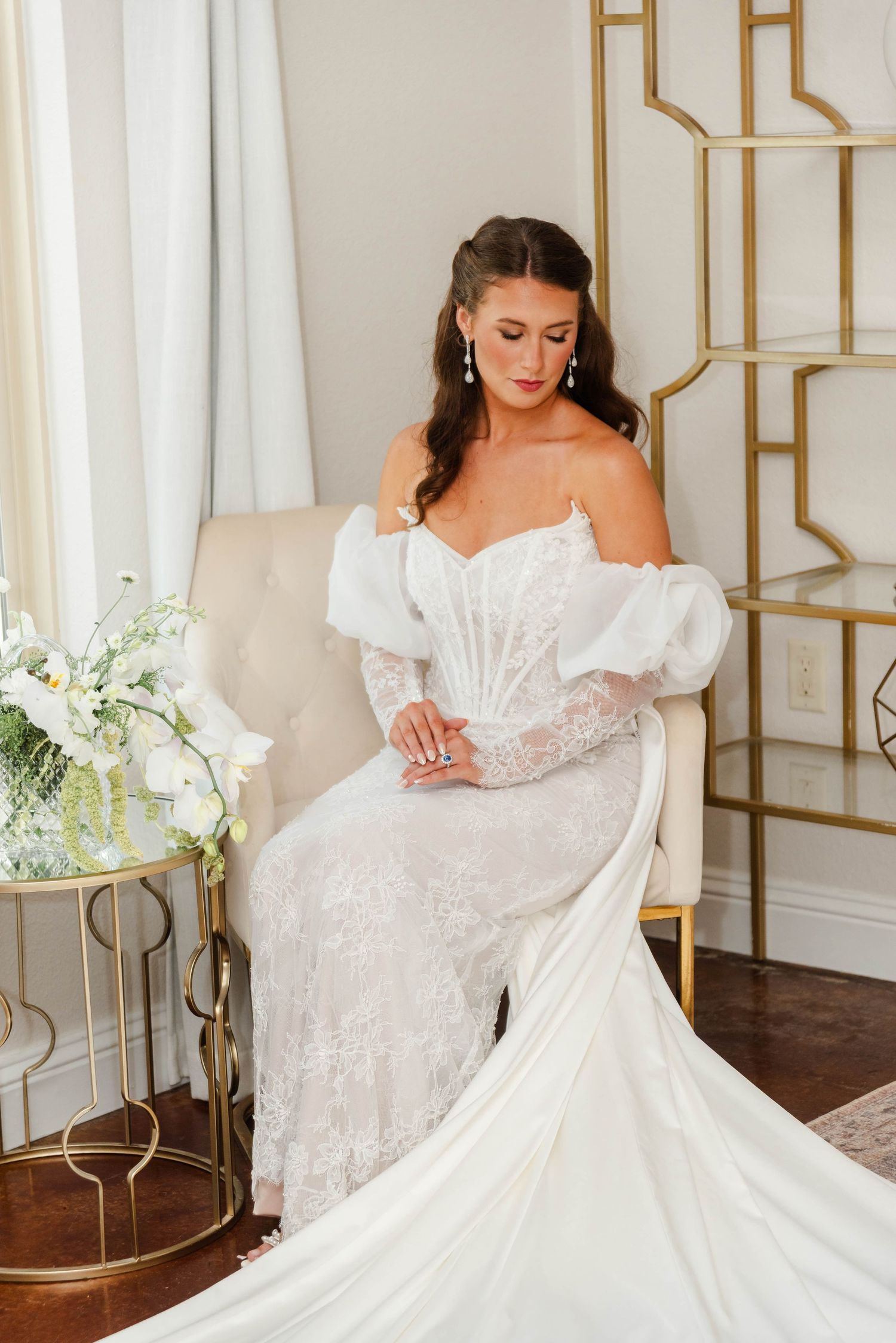 Bride looking at her dress in bridal suite