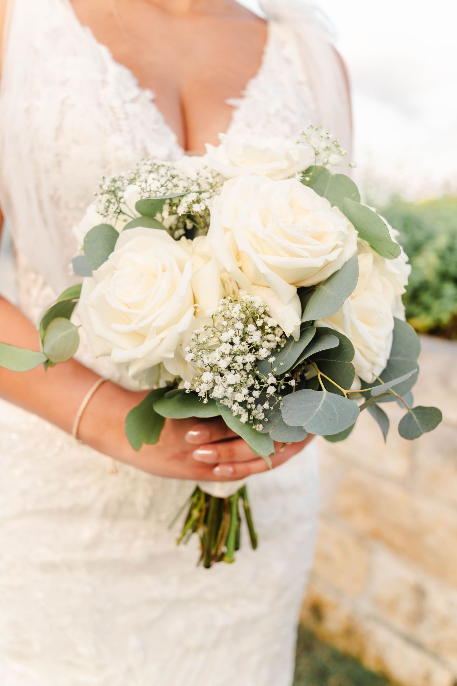 Bride in Waco TX holding bouquet Wolfe Florist