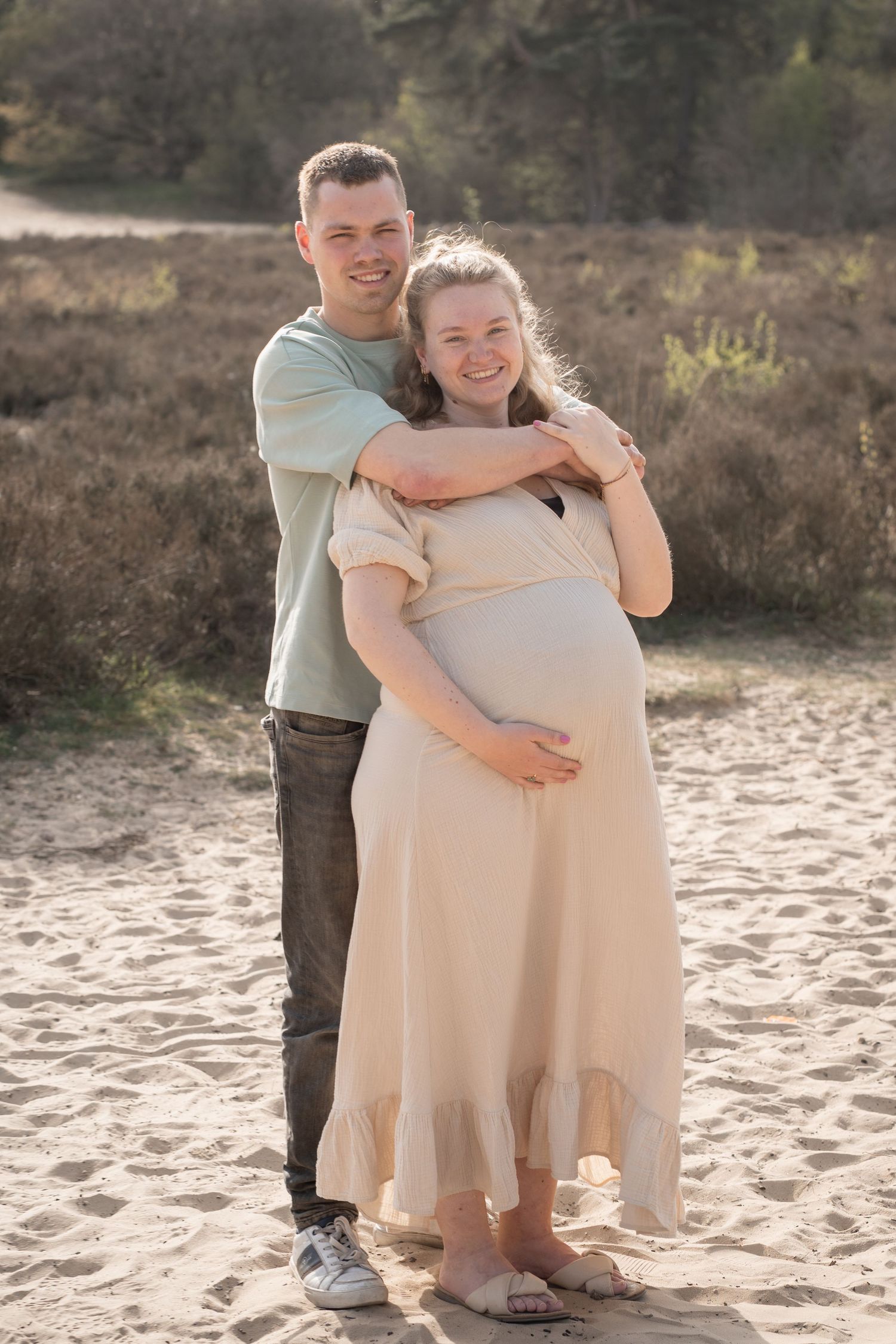couple maternity photoshoot sunset glowing