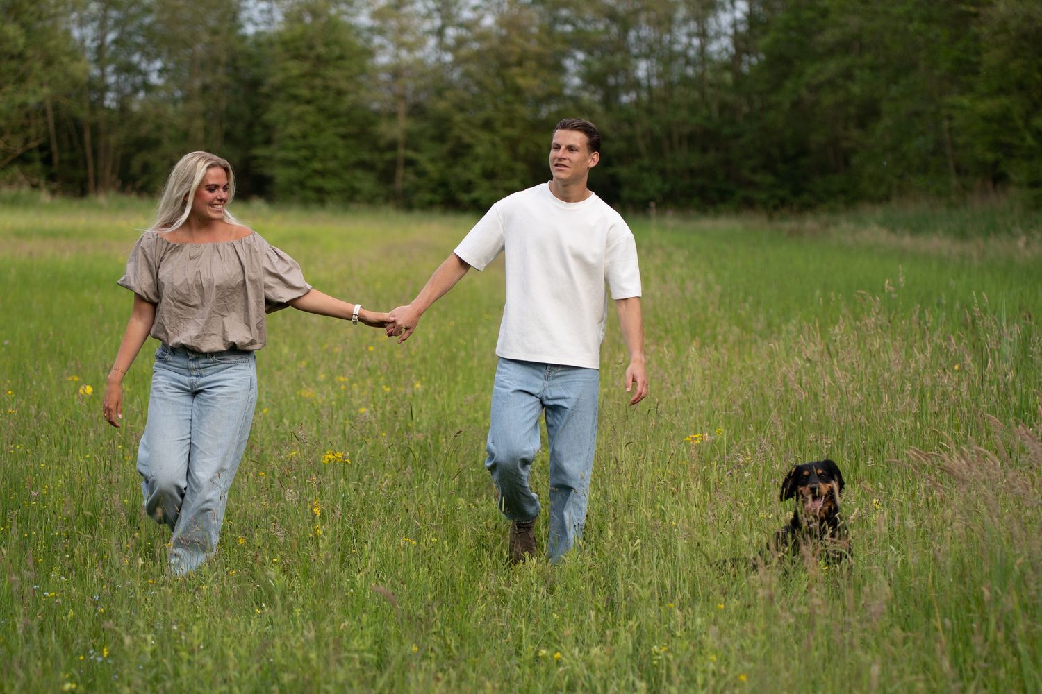 walking with dog couple