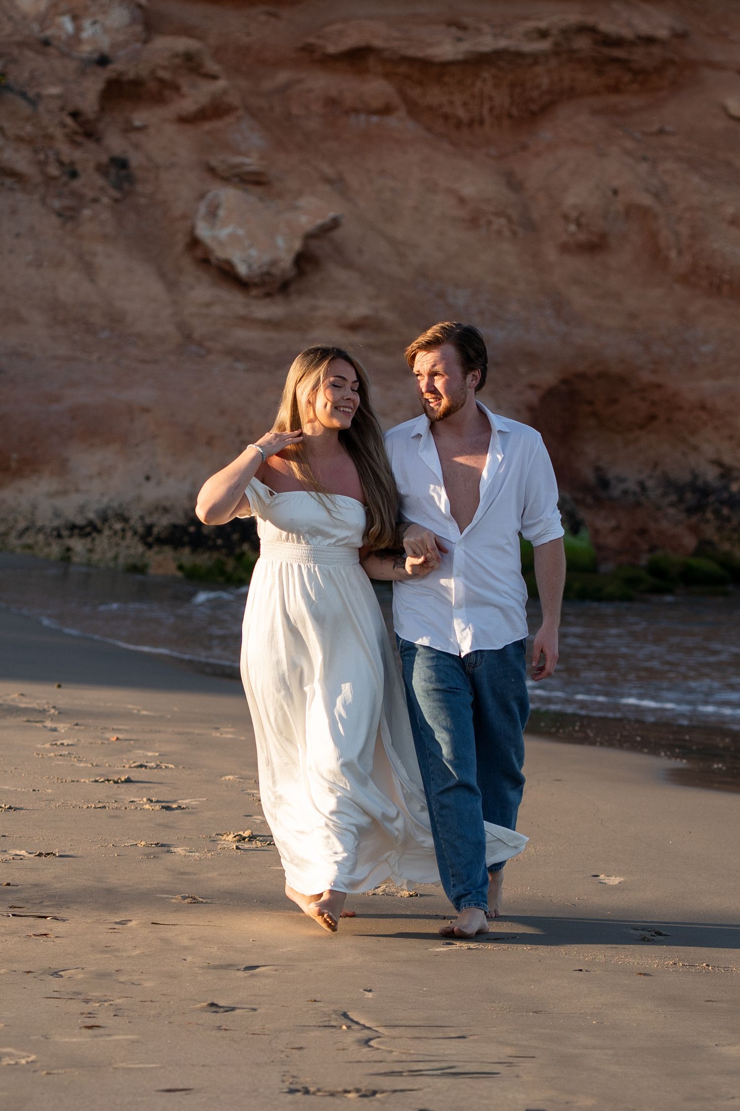 walking smiling couple session beach