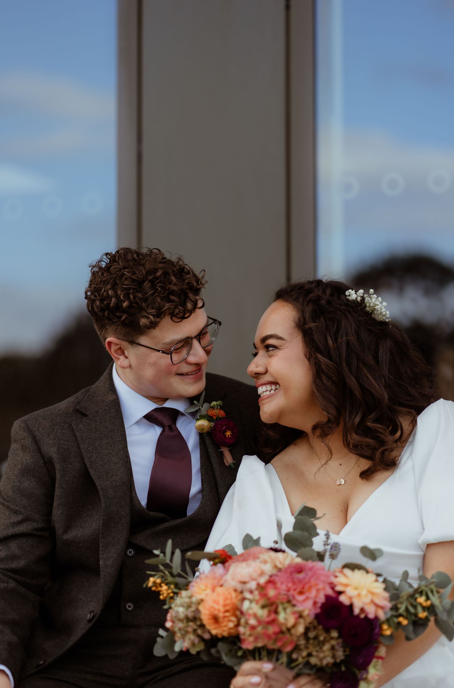 Bride and groom having a relaxed wedding portrait in London