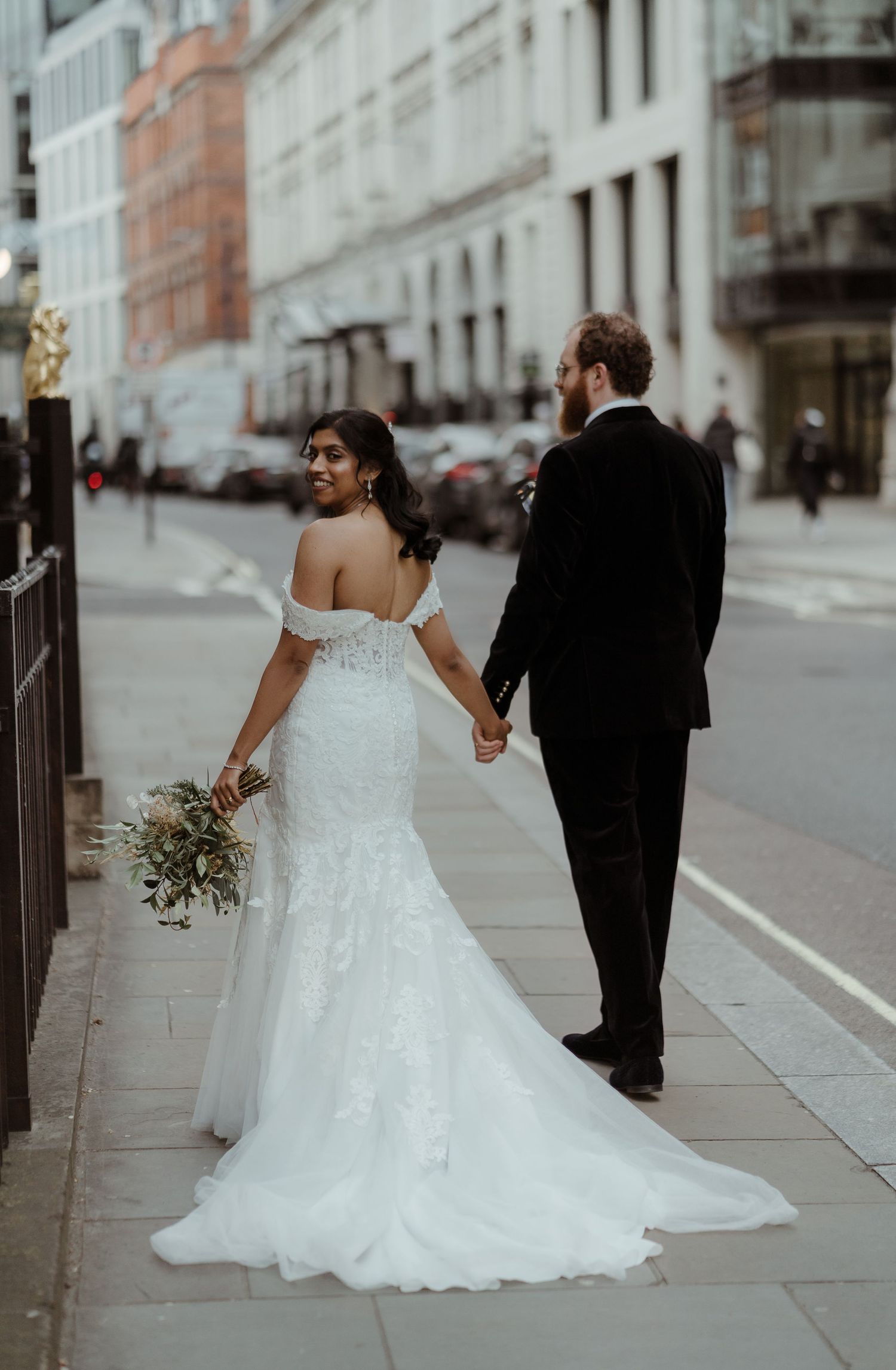 Newlyweds walking through the streets of London after their wedding