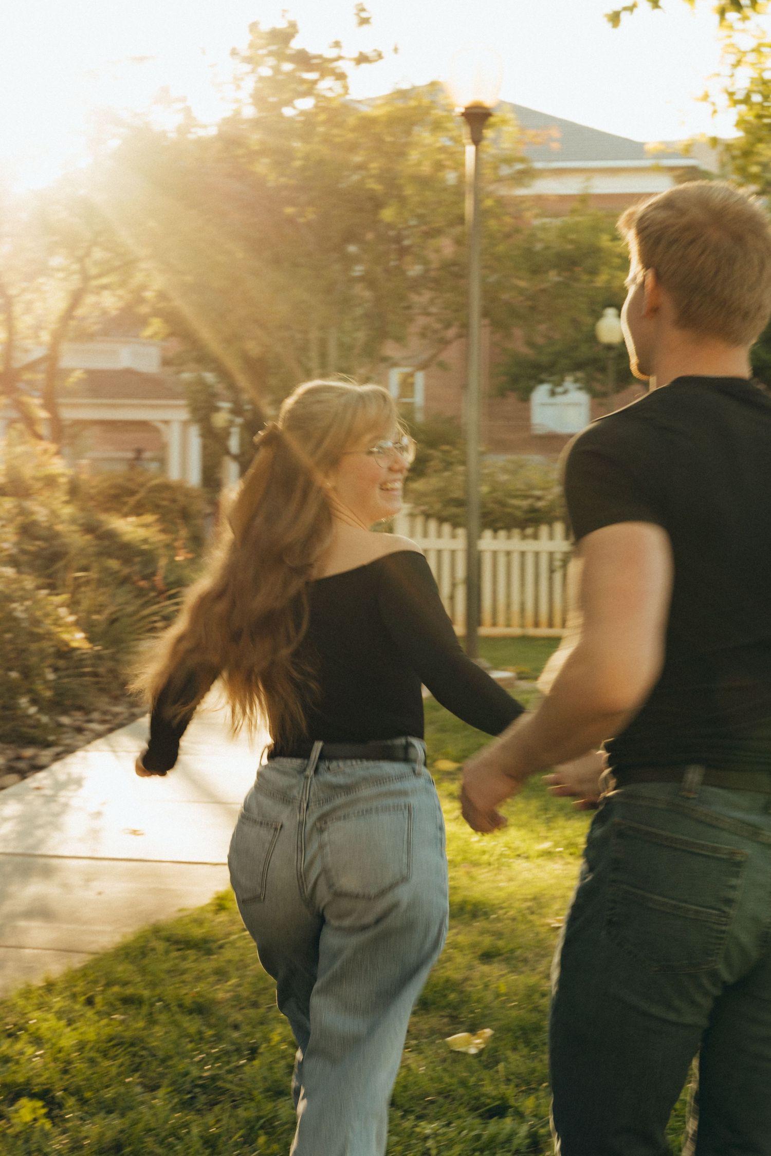 Couple running hand in hand with motion blur, capturing a sense of joy and movement