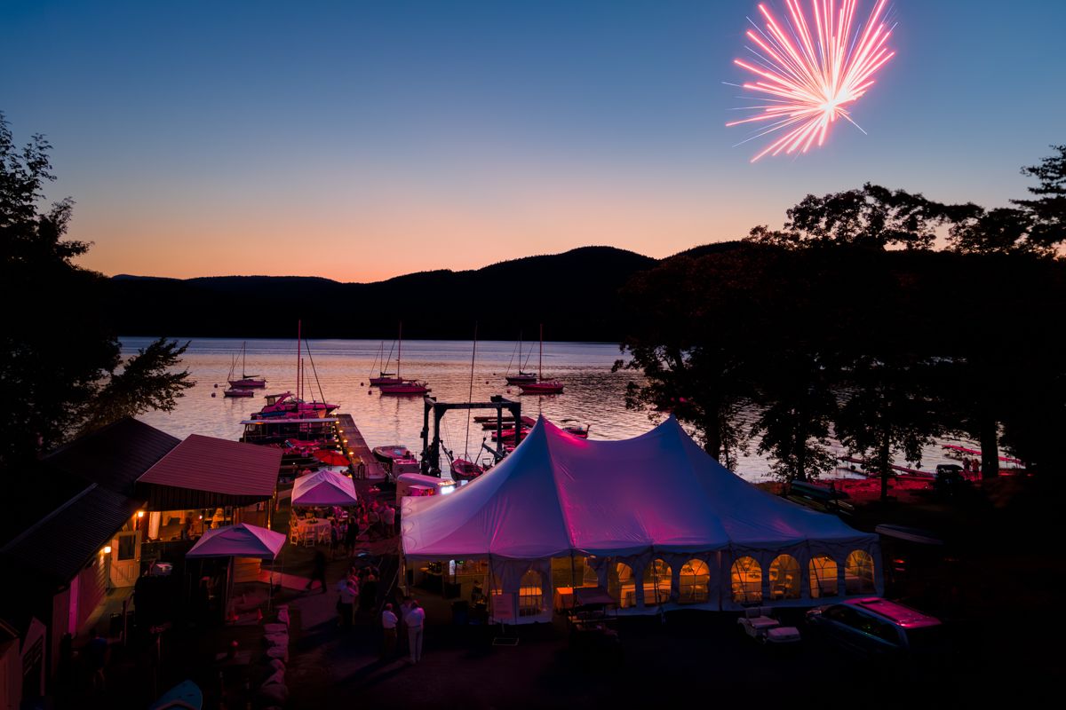 Fireworks illuminate the wedding reception of an Adirondack bride and groom on the shores of Lake Champlain, in upstate New York