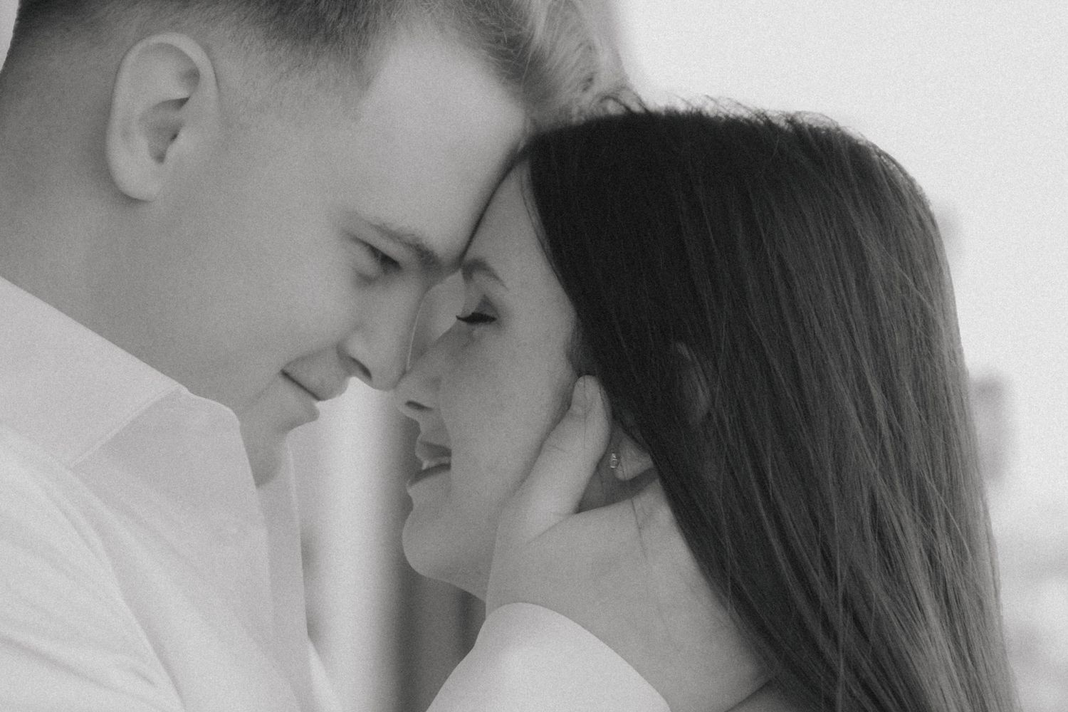 Romantic black and white photo collage showing intimate moments between couples in close embrace.