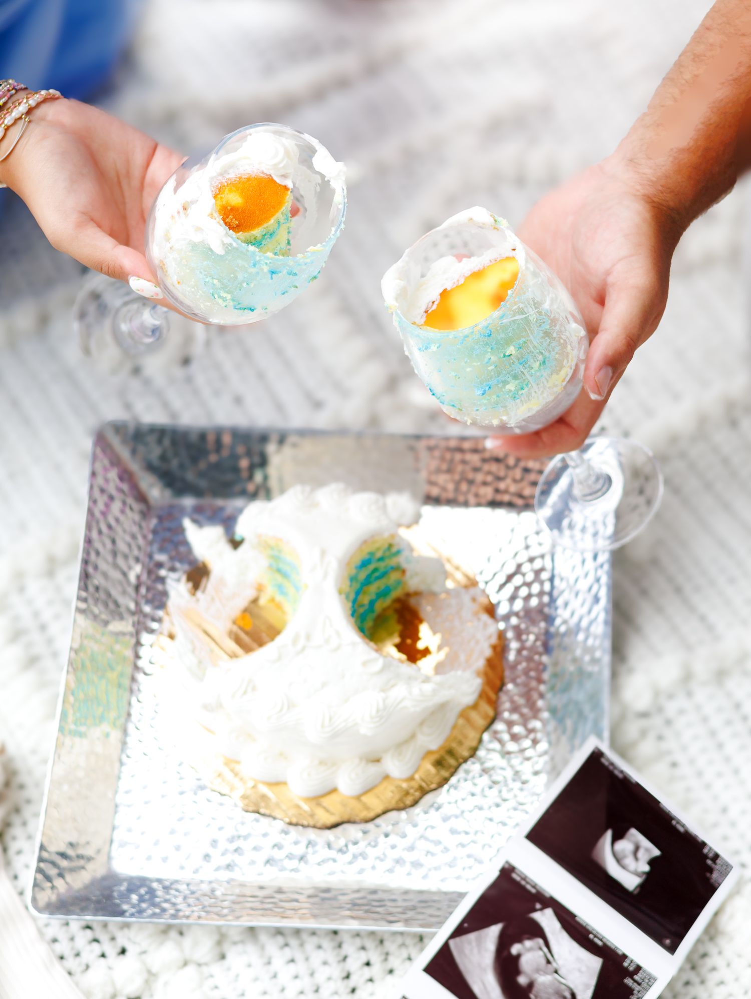 Close-up shots of hands decorating cookies with colorful frosting and toppings on a metallic surface.