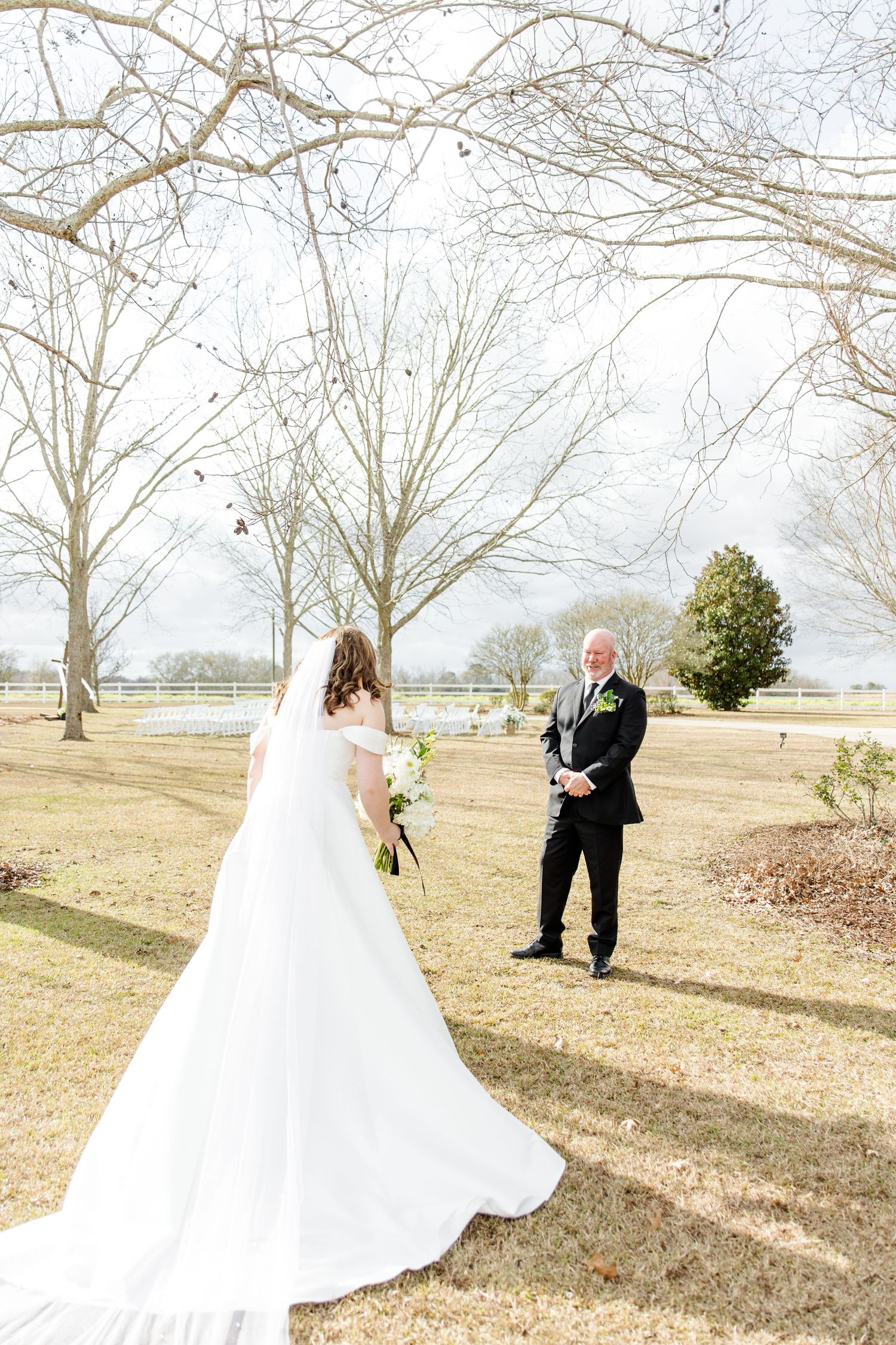 A wedding first look moment captured in a series of photos showing the couple meeting outdoors on a winter day.