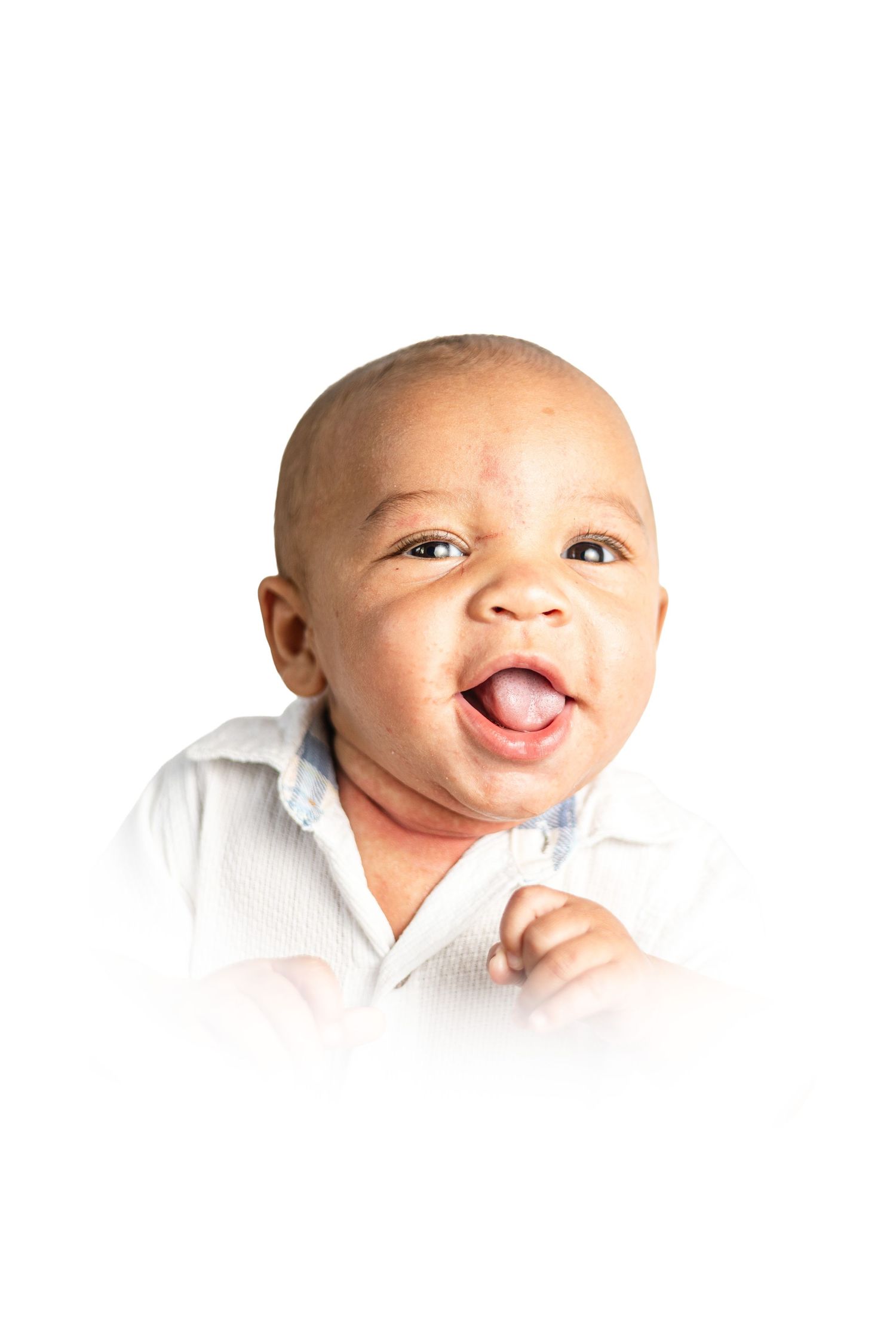 Three close-up photos of a happy baby smiling and sticking out their tongue in white clothing against white background.