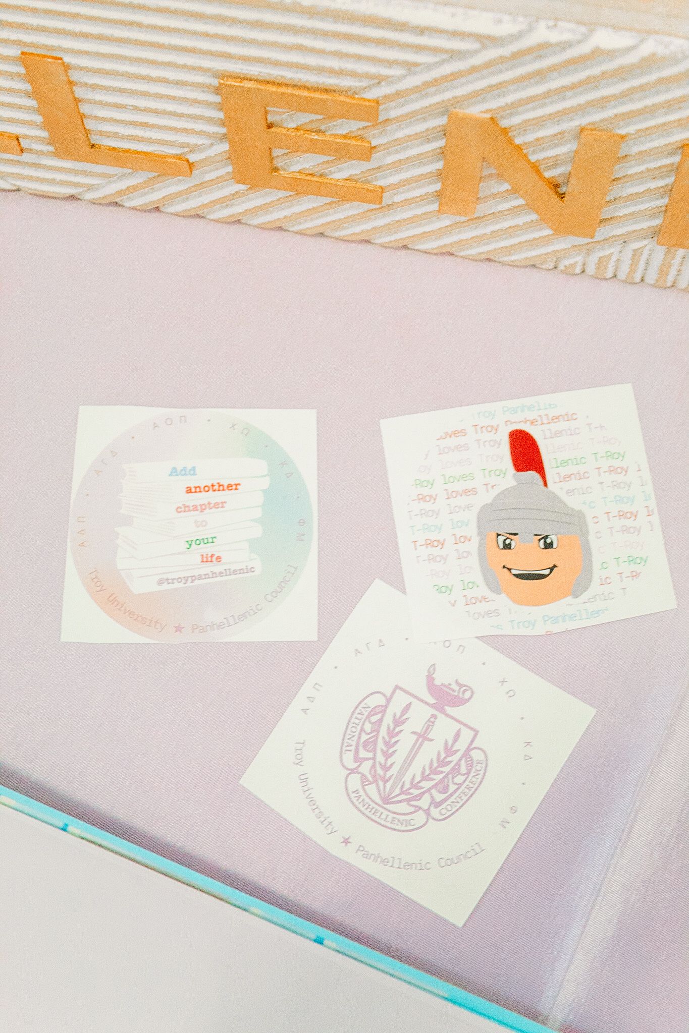 Stop motion animation frames show a paper cutout character's head rotating and moving across a light colored surface.
