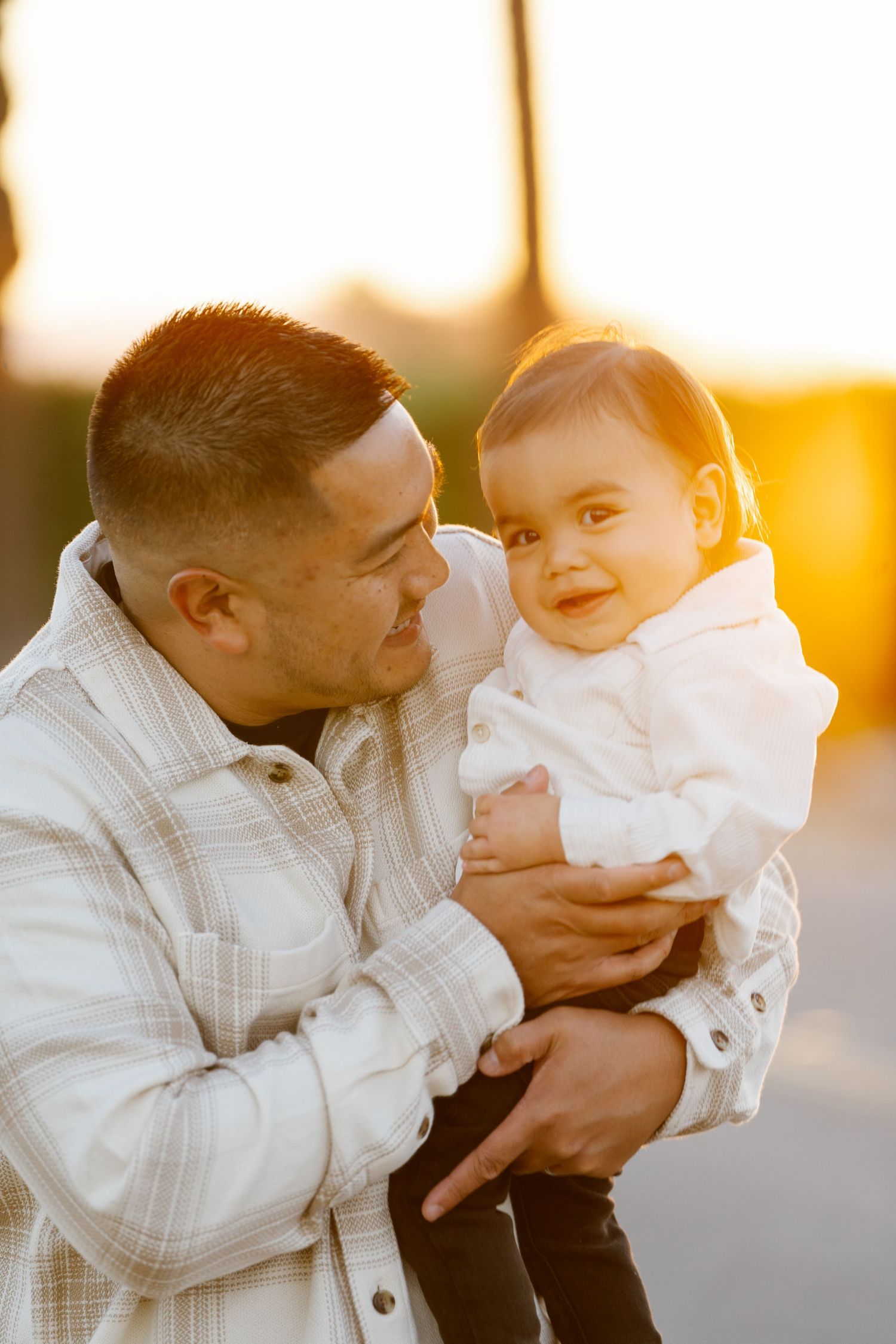 A heartwarming embrace between parent and child during a golden sunset.