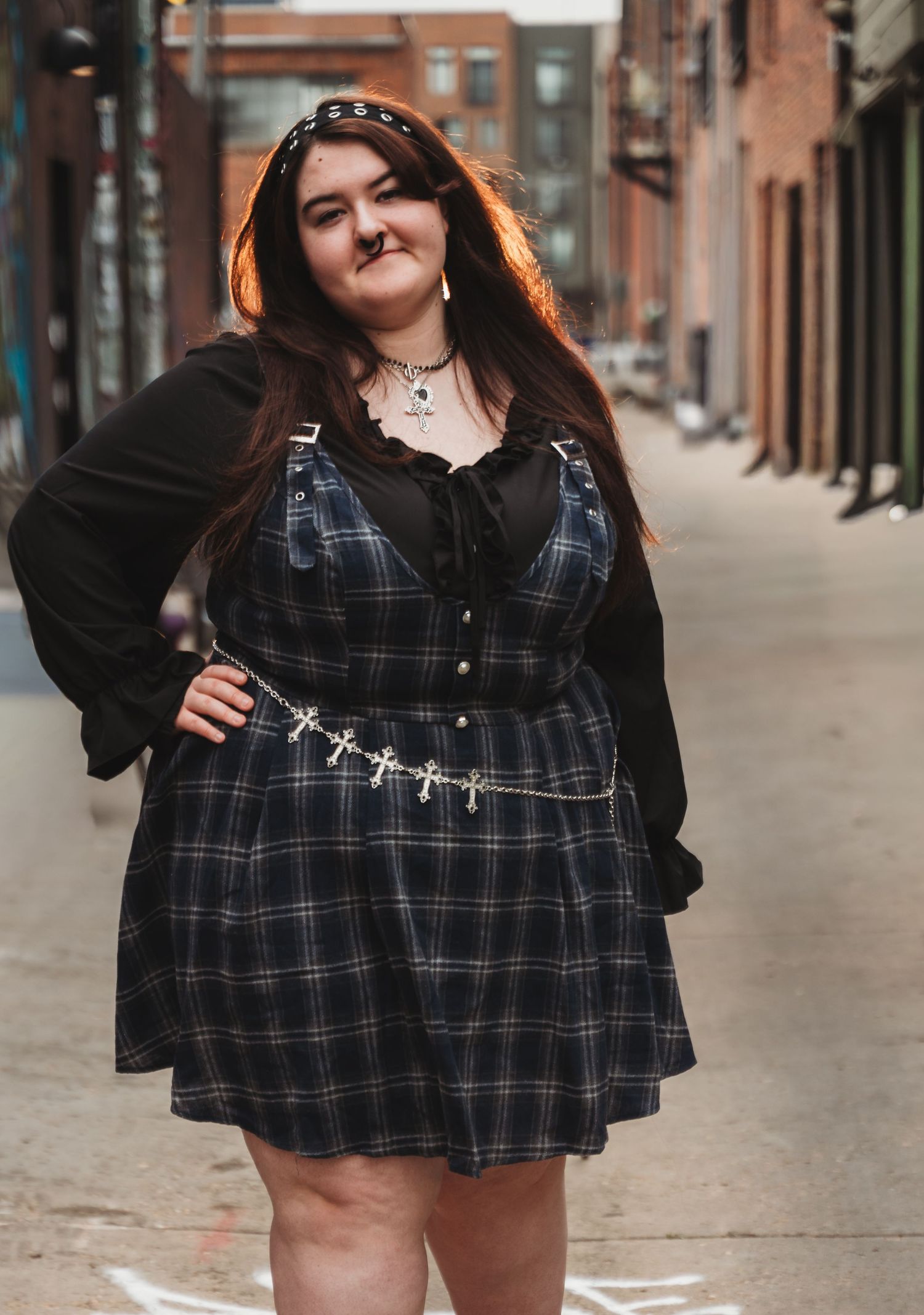 a woman in the alley in RiNo in Denver, CO for a senior session