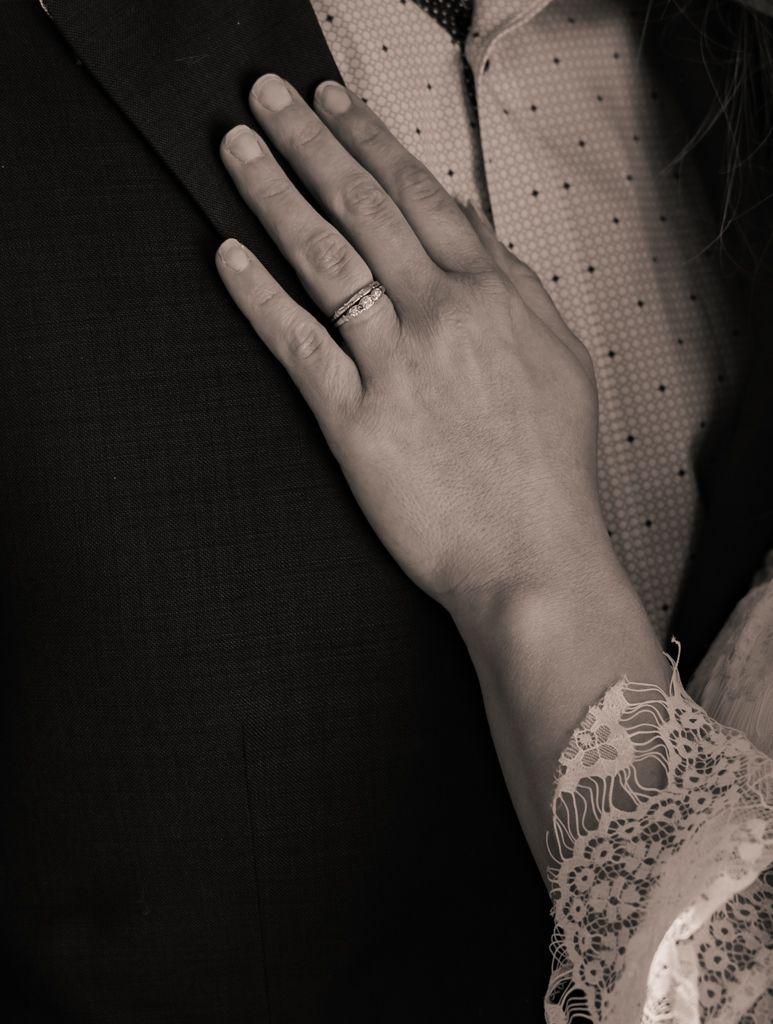 Black and white detail shots of hands with delicate lace details.