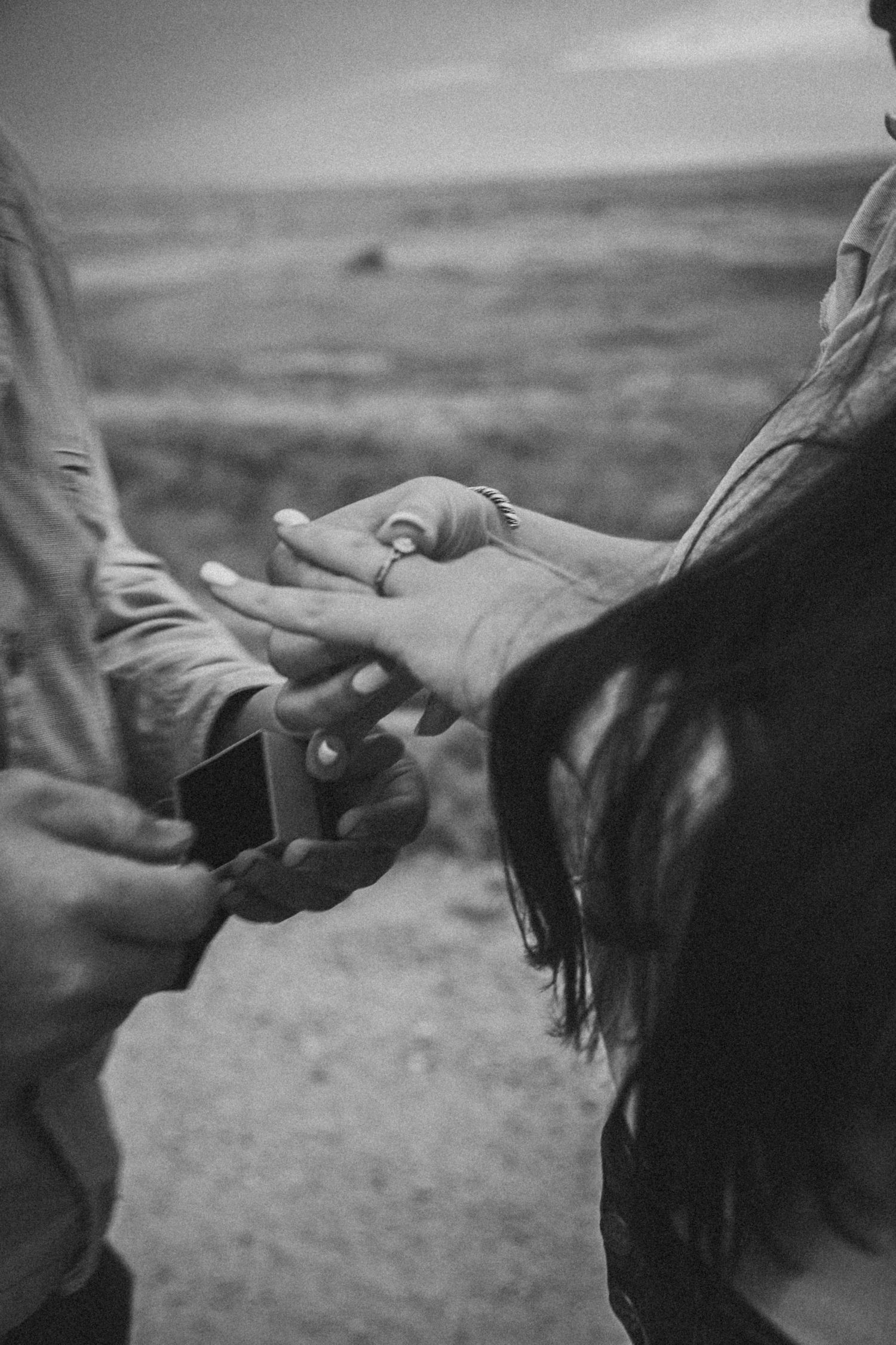 Black and white image sequence showing arms reaching up to a darkened sky in dramatic gestures.