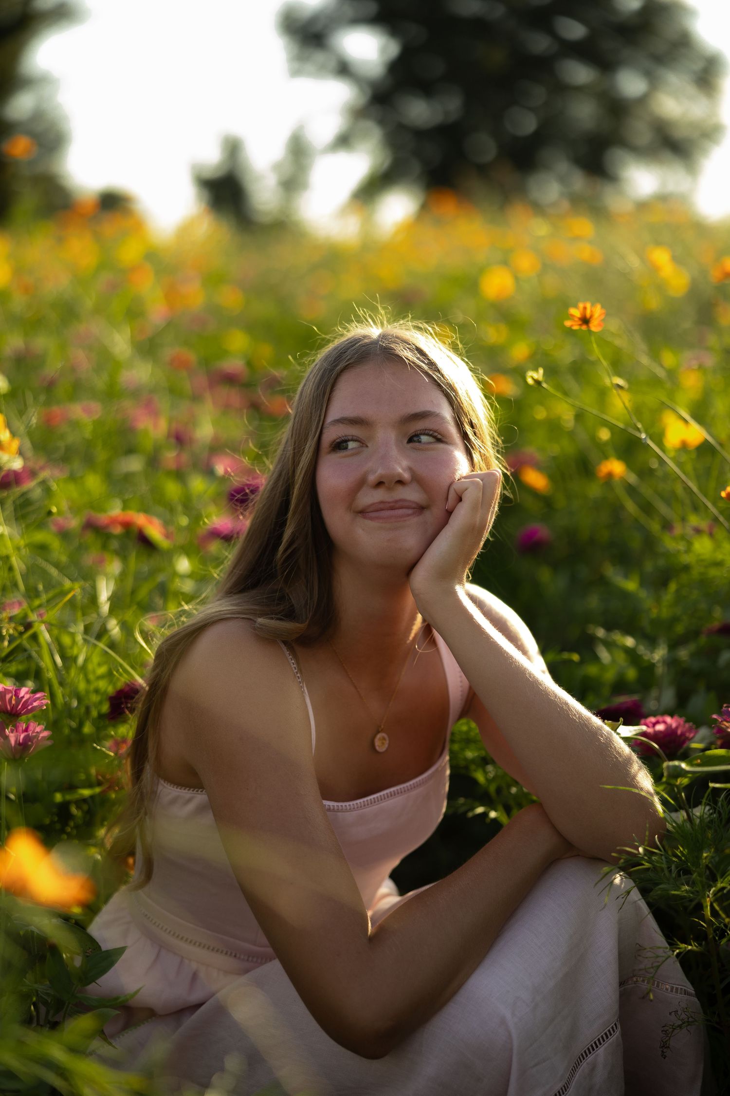 Soft portrait sequence showing someone relaxing outdoors among wildflowers at golden hour.