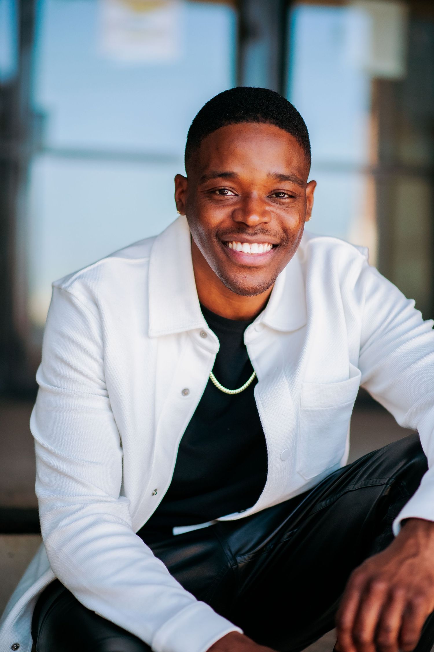 Actor Jerry Davis Jr
Professional portrait of headshots featuring poses in a white jacket and black shirt against a neutral background.