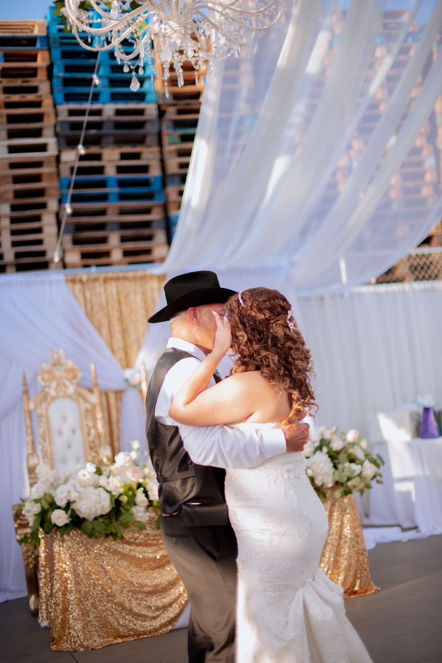 Wedding dance captured in sequence showing tender moments between the Father and daughter under elegant white drapes.