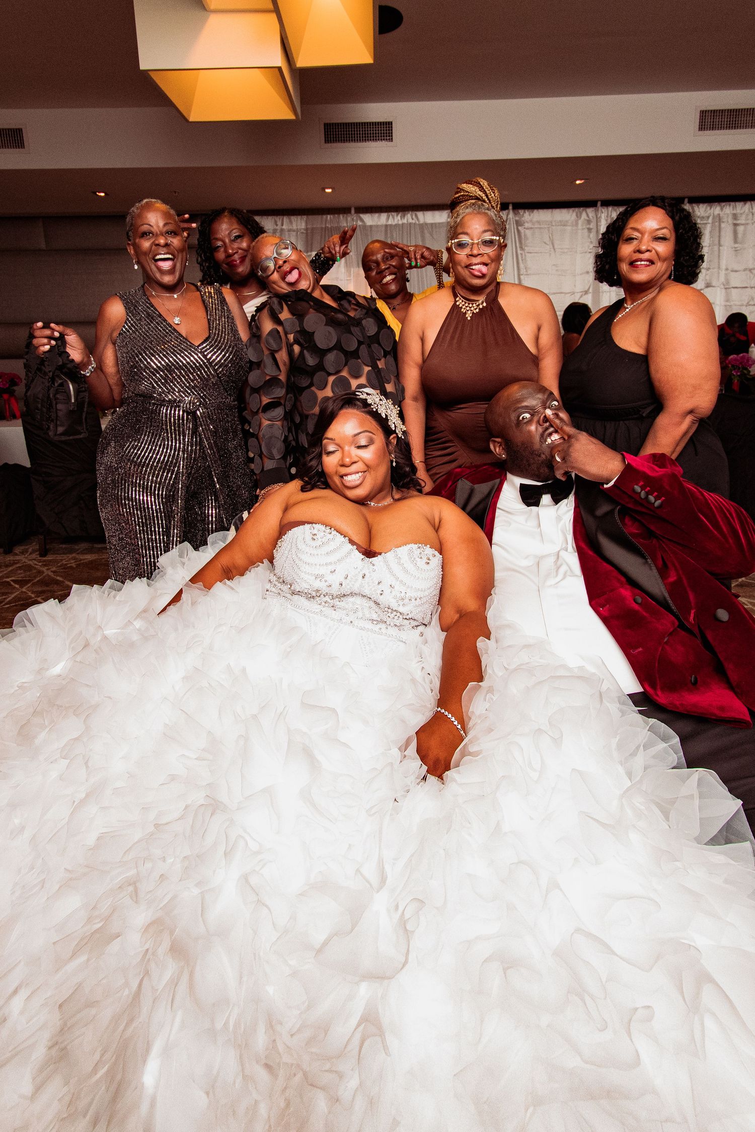 Wedding reception celebration showing flowing white dress and joyful dancing on the dance floor.