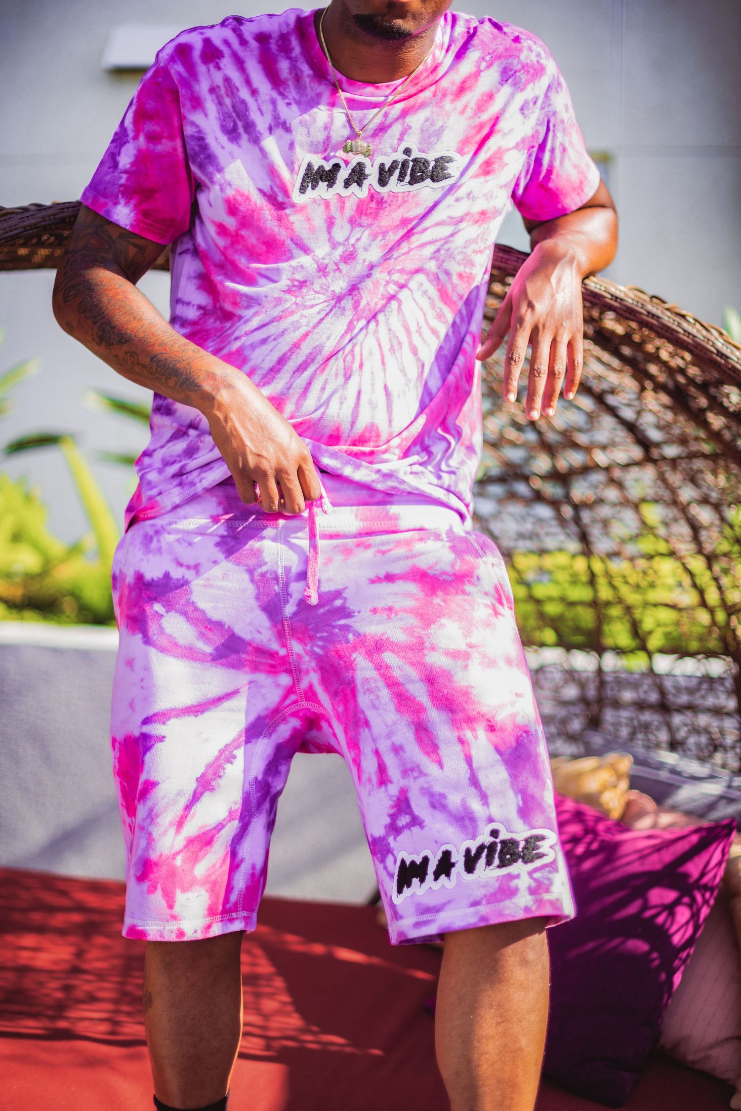 Pink and purple tie-dye matching set with 'Im a vibe' text displayed in outdoor setting.