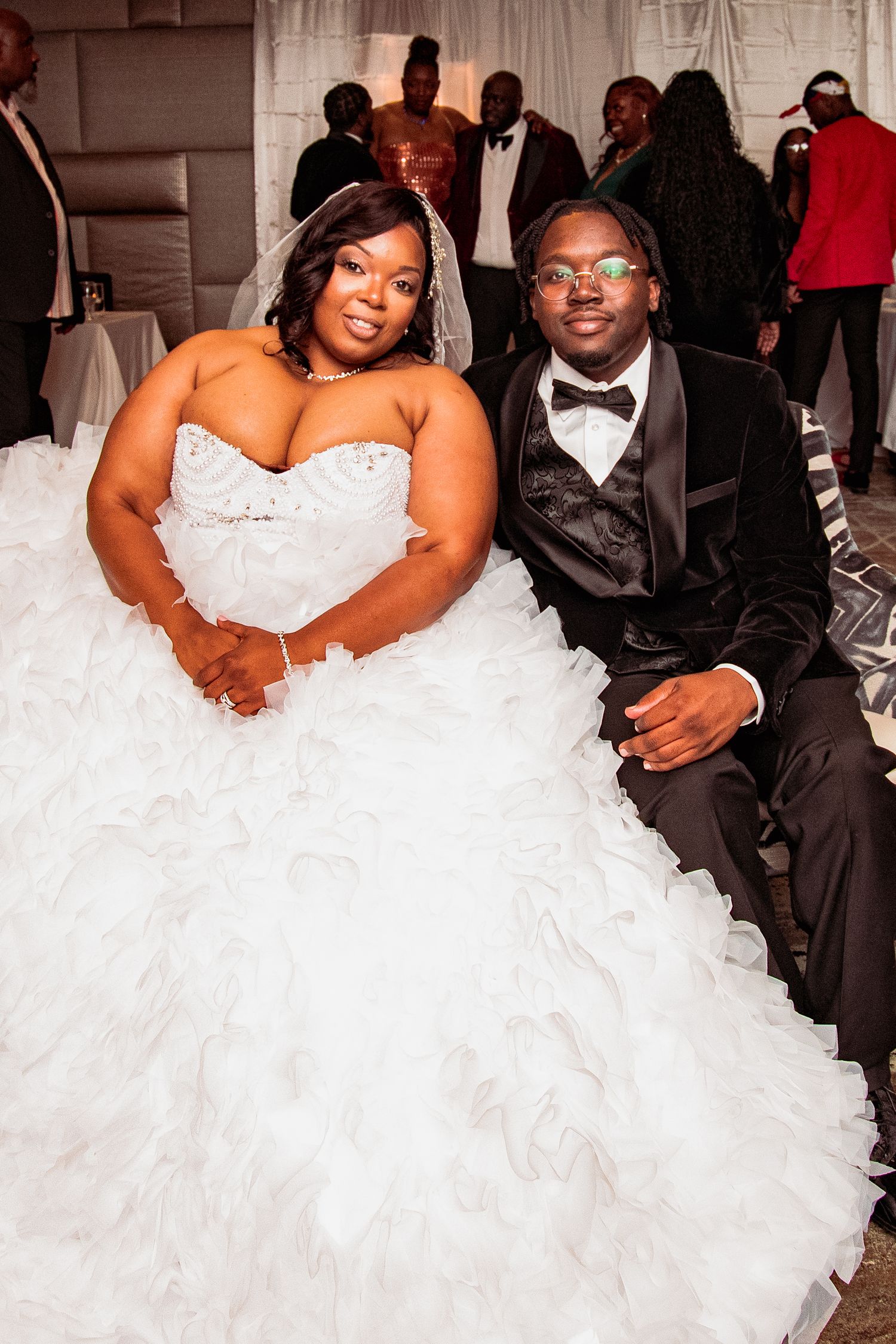 A series of candid wedding reception photos showing tender moments between the couple in formal attire.