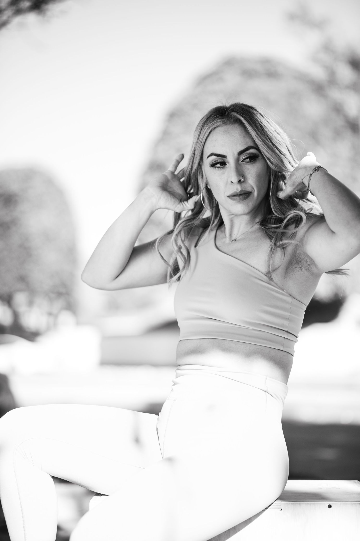Artistic black and white photos showing athletic poses in outdoor setting.