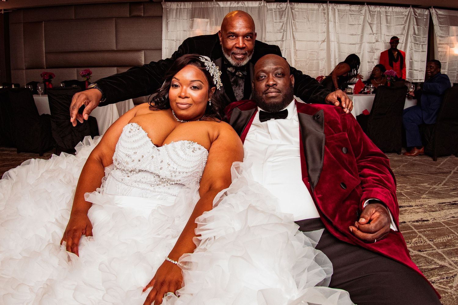 Newlyweds share a joyful moment together during their wedding reception.