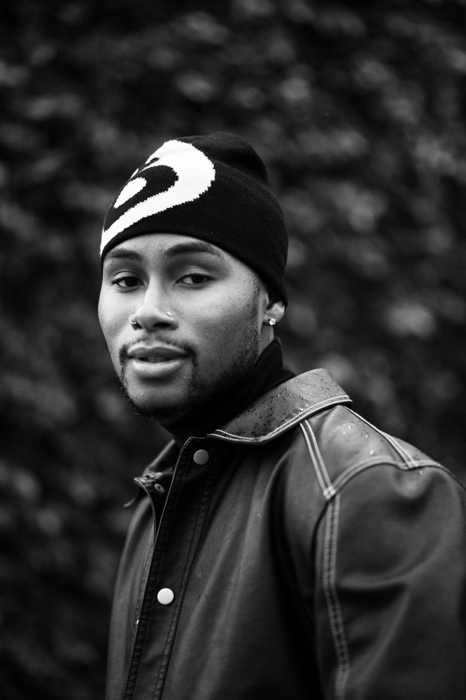 Paris B newfaceofrnb_ black and white portrait series showing subject in leather jacket and beanie, Street Photo Shoot in Los Angeles Ca.