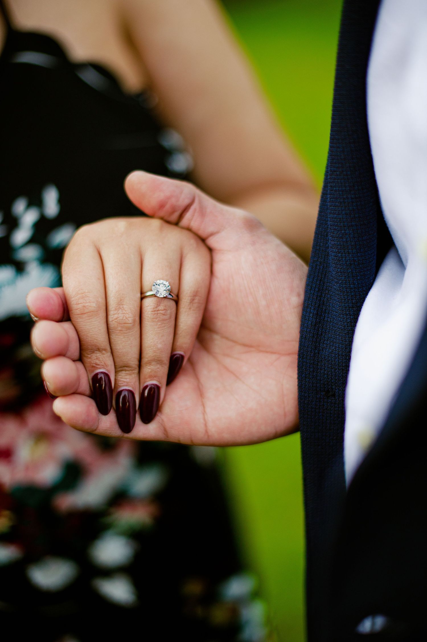 A series of four close-up photos showing intertwined hands with an engagement ring, against a blurred green background.