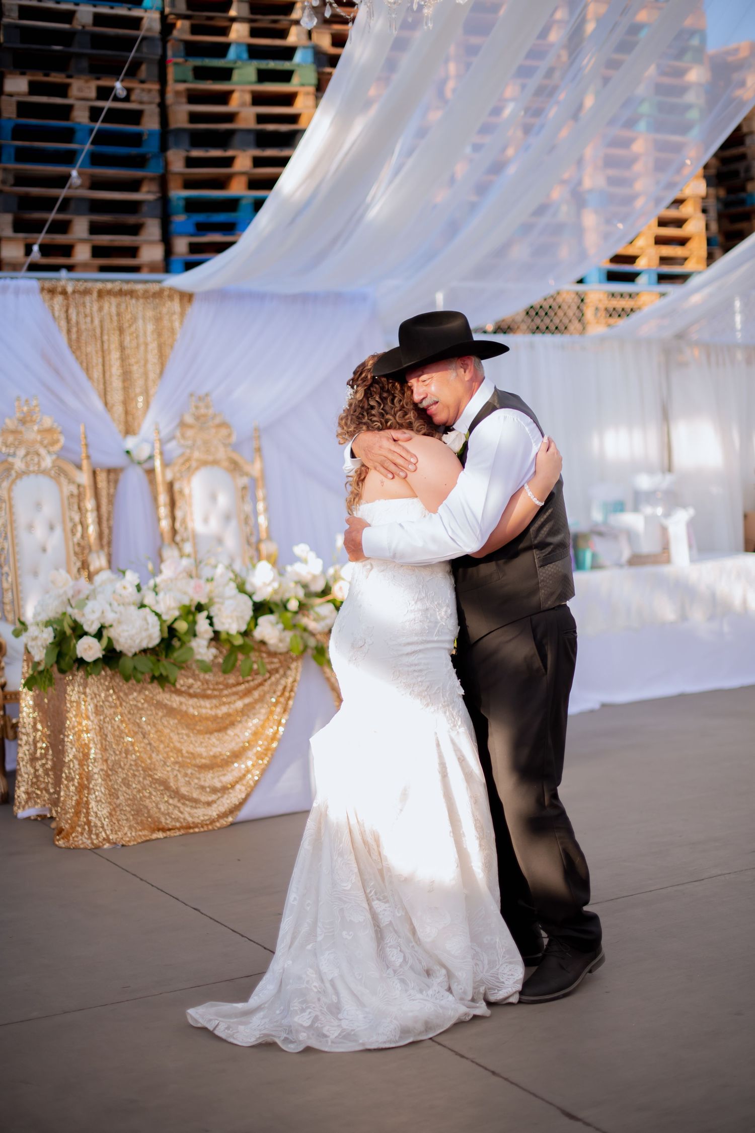 Wedding dance captured in sequence under white tent with romantic lighting and decorations.